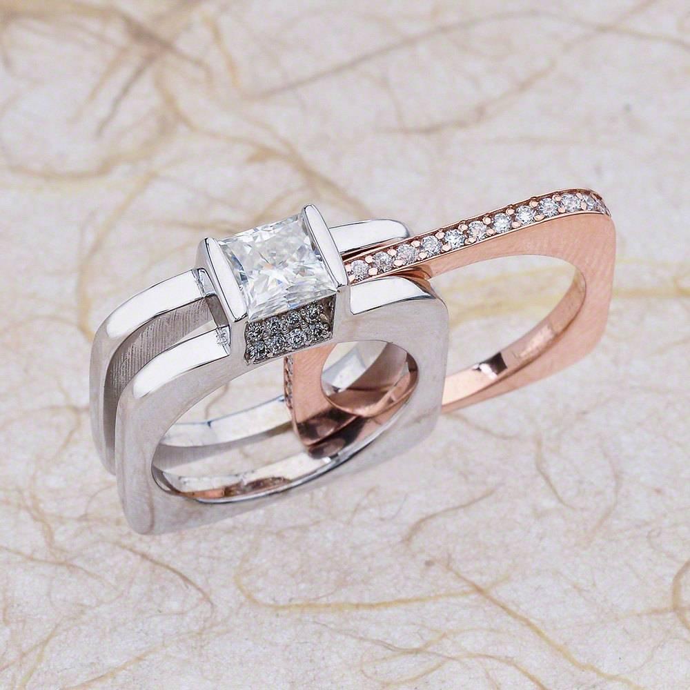 - Center Stone: Princess Cut Moissanite 5.5mm (1.00ct)
- Side Stones: Round Cut Diamonds 0.50ctw / Graded G SI1
- Metal: 14K White and Rose Gold (Rose Gold can be changed to Yellow or White upon request)

This piece is made-to-order. Please allow up