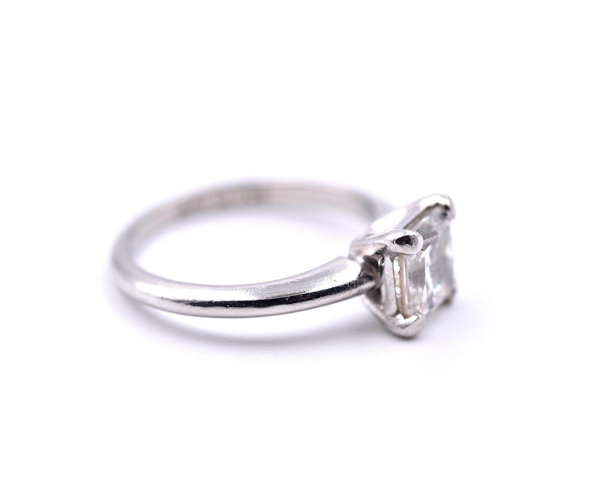 Designer: custom design
Material: Platinum 
Center Diamond: 1 princes cut= 1.00ct GIA 15167077
Color: G
Clarity: VVS1
Ring size: 3 ¼ (please allow two additional shipping days for sizing requests) 
Dimensions: ring is approximately 6.41mm by