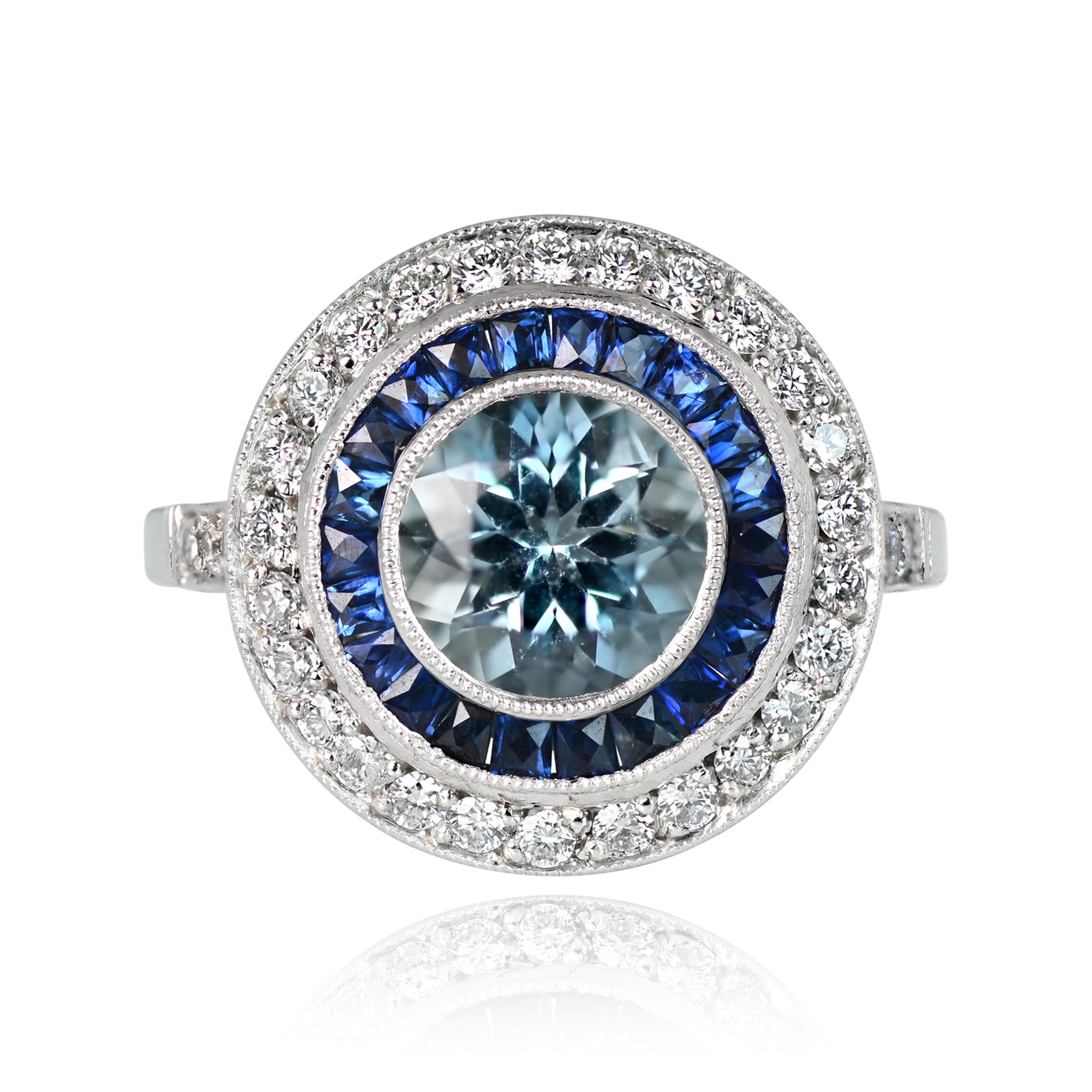 This exquisite ring showcases a vibrant 1.00-carat aquamarine with a lively teal saturation. It is encircled by a double row of calibrated French-cut sapphires and a halo of old European-cut diamonds. Meticulously hand-crafted in platinum.


Ring