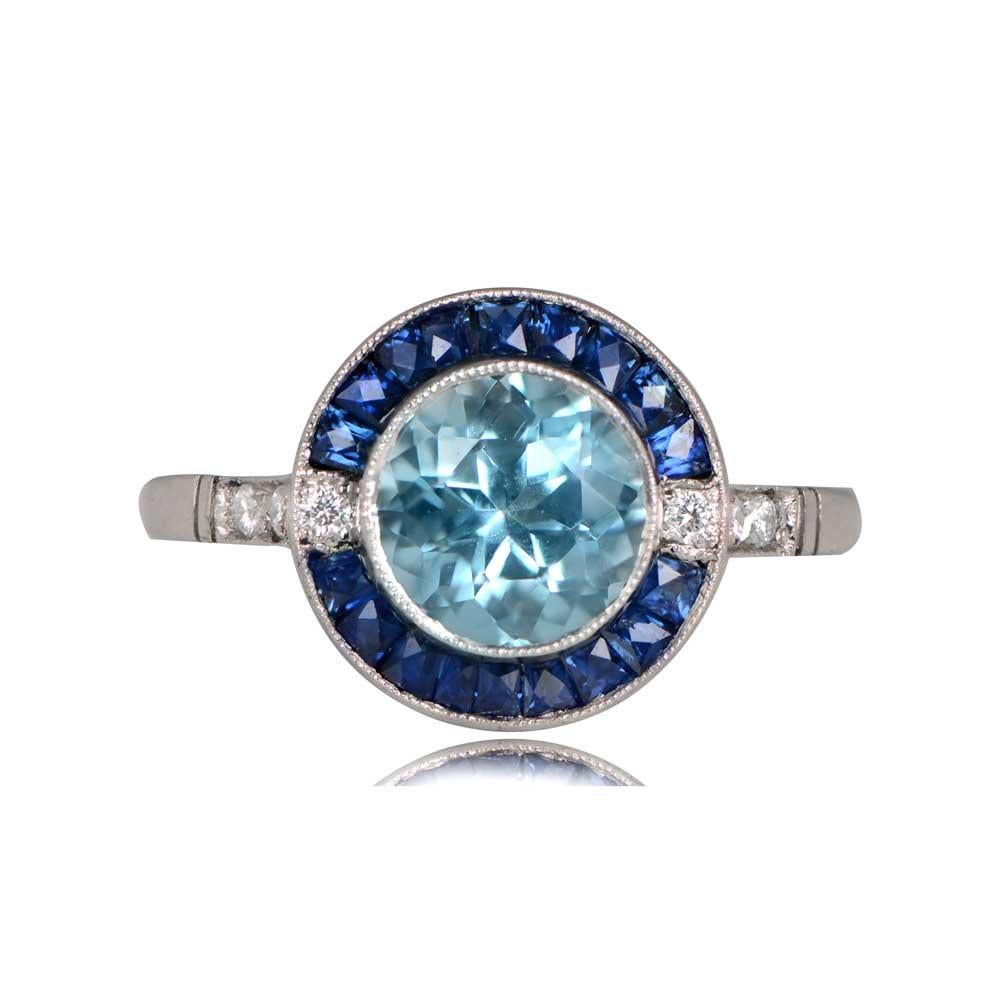 Thames Ring: This captivating ring features a round-cut 1.00-carat aquamarine as its centerpiece, encircled by a halo of French-cut sapphires totaling around 0.54 carats. The shoulders are adorned with additional diamonds, contributing a combined