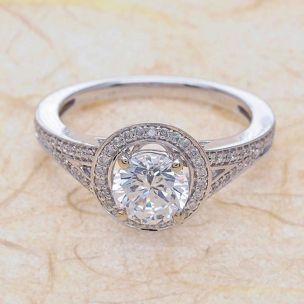 - Center Stone: Round Cut Moissanite 6mm (1.00ct)
- Side Stones: Round Cut Diamonds 0.30ctw / Graded G SI1
- Metal: 14K White Gold

This piece is made-to-order. Please allow up to 7 Business Days to accomplish.