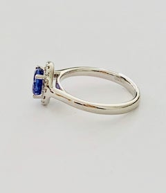 1.00 Carat Round Tanzanite in a Diamond Halo Design Set in Platinum