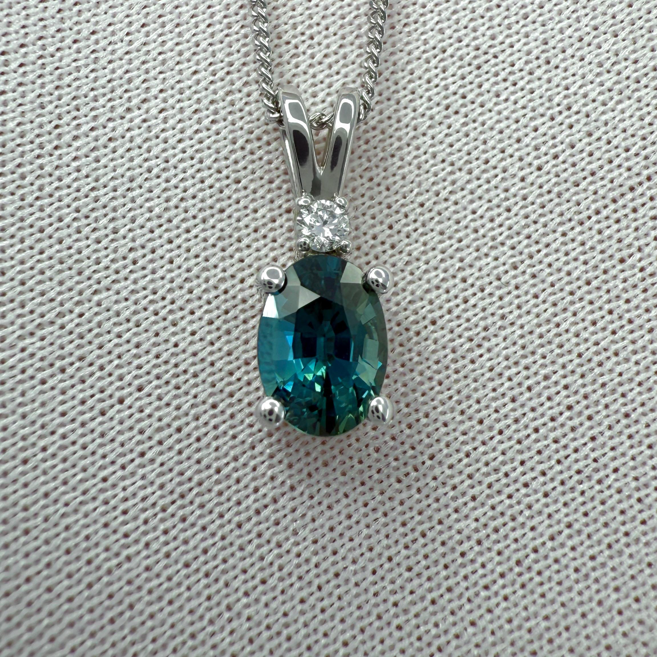Natural Vivid Teal Blue Oval Cut Sapphire And Diamond 14k White Gold Pendant Necklace.

1.00 Carat natural sapphire with a fine vivid teal blue colour and an excellent oval cut.
This sapphire also has excellent clarity, a very clean stone. VVS.

The