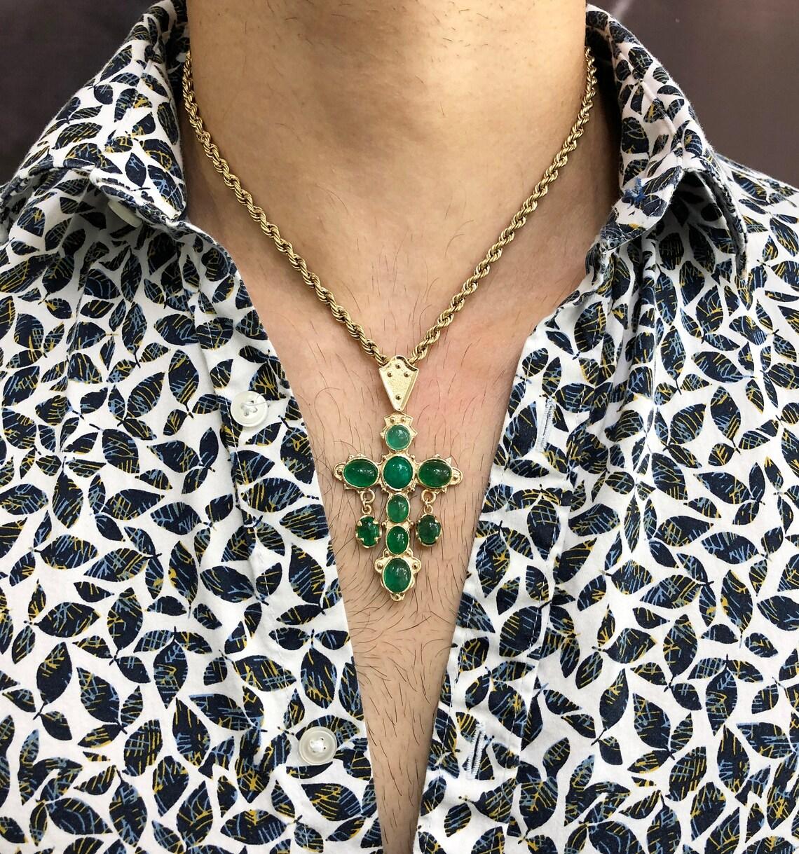 This is a Replica-rich Green Emerald Cabochon and 14K or 18K Yellow Gold from the famous Atocha Shipwreck. There are 9 rich Green Cabochon Emeralds weighing 10 Carats. The cross is approximately 3 inches long by 1.5 wide. It's set in a beautiful 14K