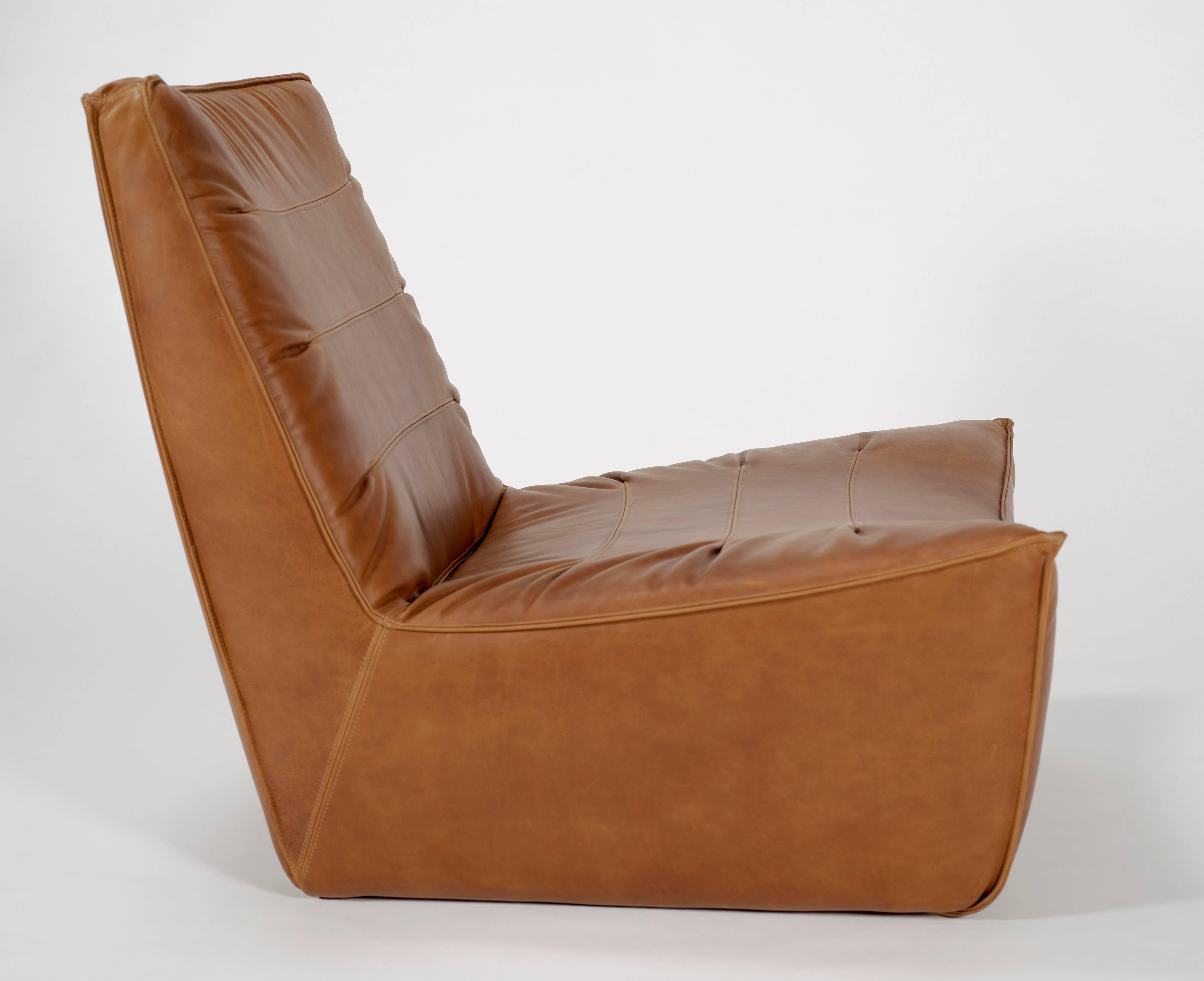 Our pinch chair is a fully upholstered chair in whiskey leather.

This comfy lounger take cues from the upholstery of 1970s Italian sports cars. The original was custom designed for a client in Los Angeles who wanted the perfect chair for listening