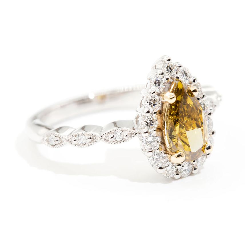 Contemporary 1.01 Carat Certified Fancy Yellow Pear Diamond and 0.42 Carat Engagement Ring For Sale