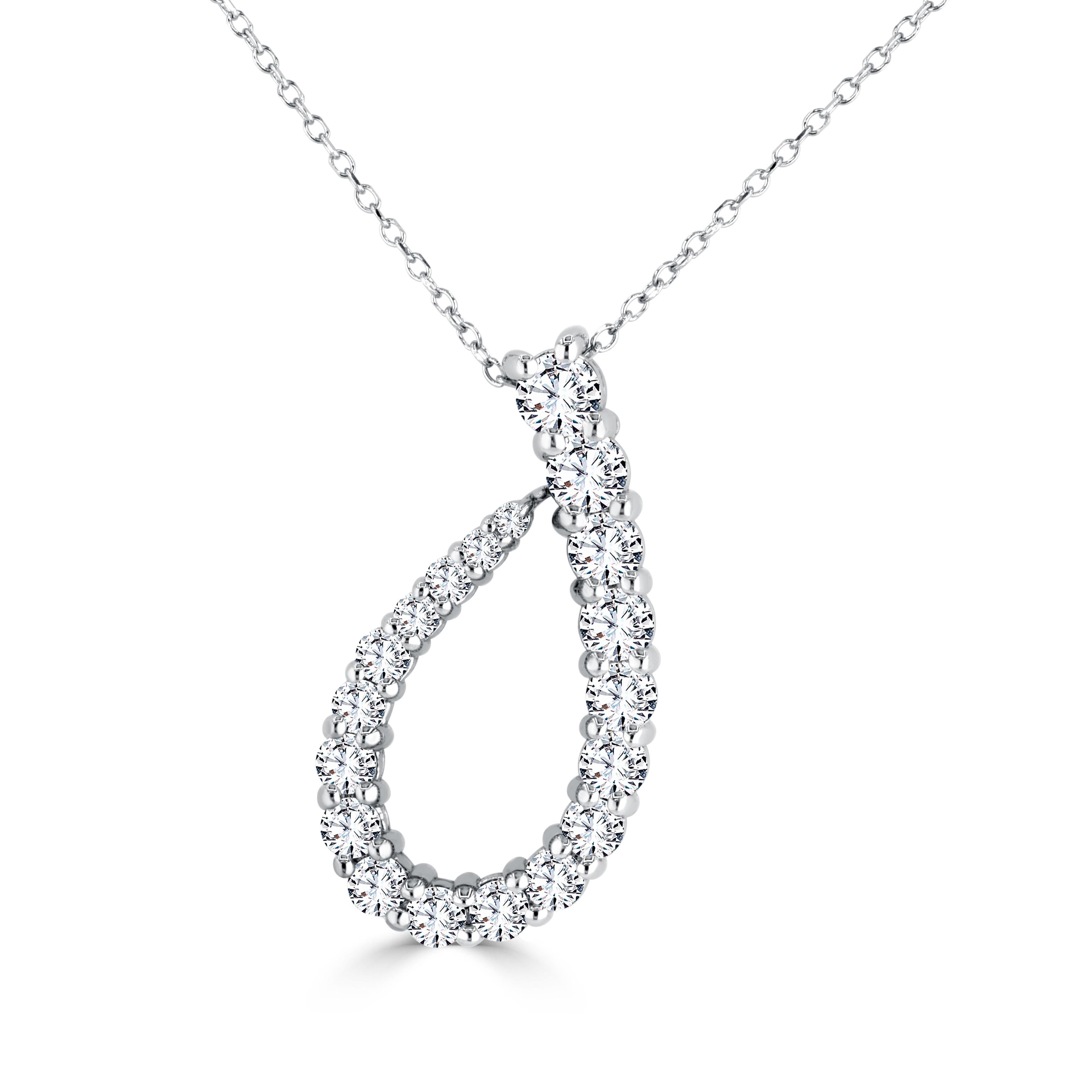 Adorning this pendant are twenty pristine, natural white diamonds, meticulously handpicked to ensure unrivaled brilliance. These diamonds gradually increase in size towards the bottom of the pendant, forming an asymmetric design that culminates in a