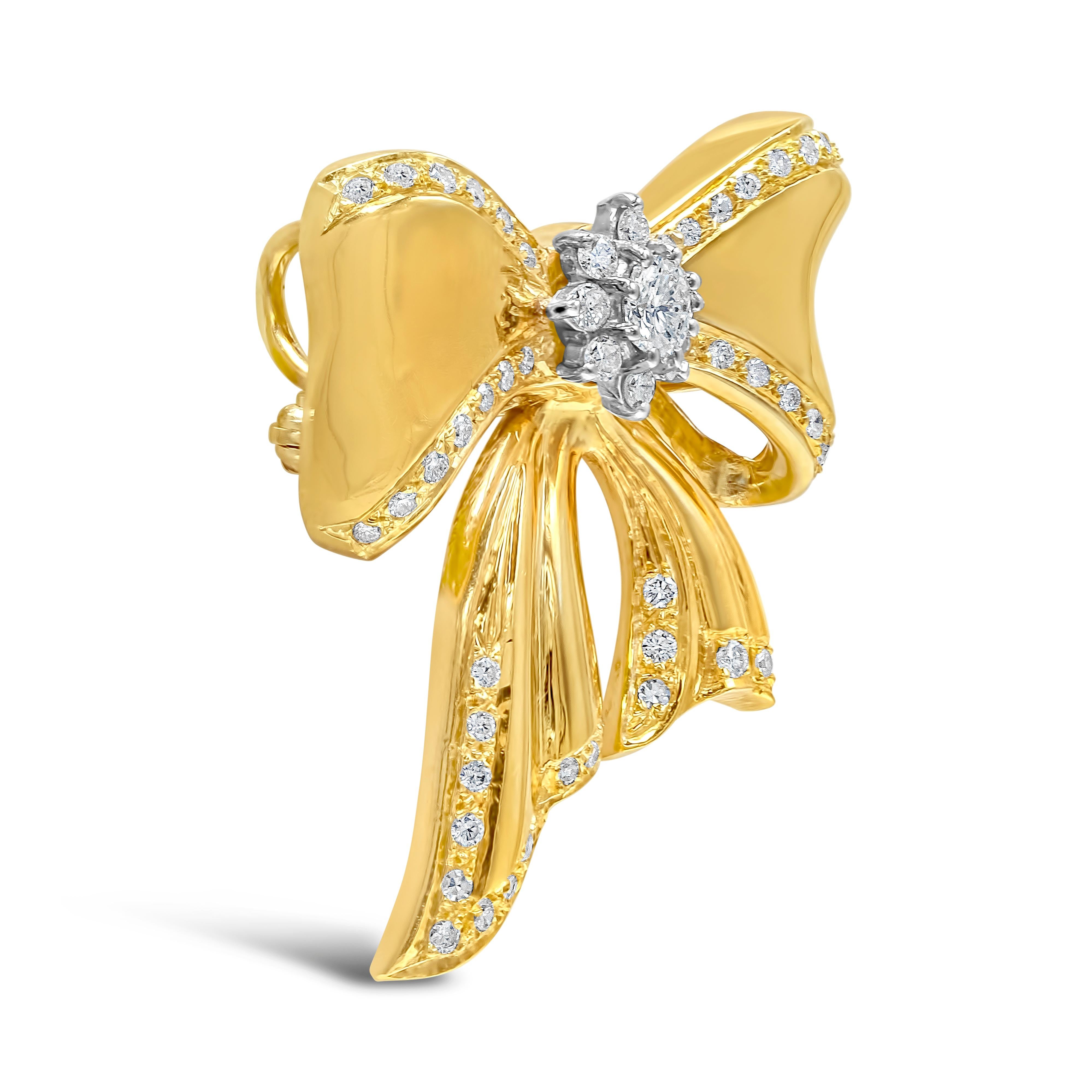 A beautiful piece of jewelry showcasing a ribbon / bow tie design made in 18k yellow gold, accented by brilliant diamonds on the center, and edges of the design. Diamonds weigh 1.01 carats total and are approximately G-H color, SI clarity.


