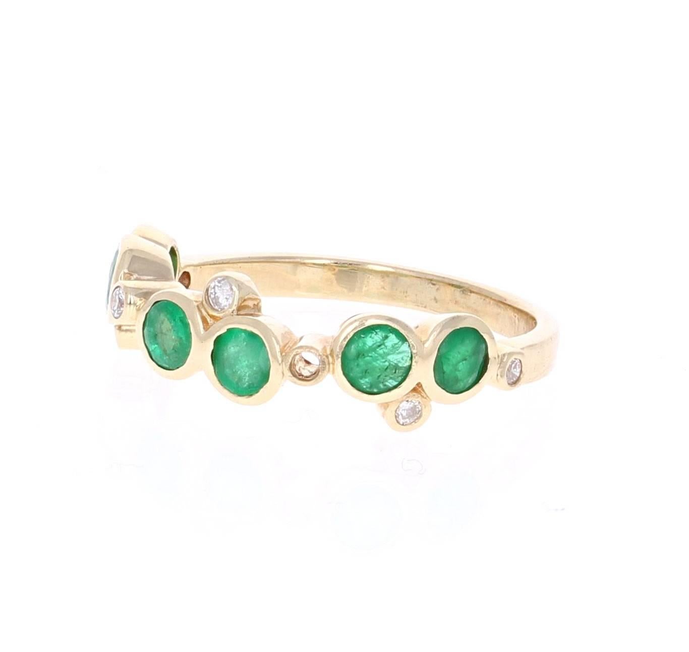 Cute and dainty Emerald and Diamond band that is sure to be a great addition to anyone's accessory collection.   There are 6 Round Cut Emeralds that weigh 0.91 carats and 7 Round Cut Diamonds that weigh 0.10 carats.  The total carat weight of the