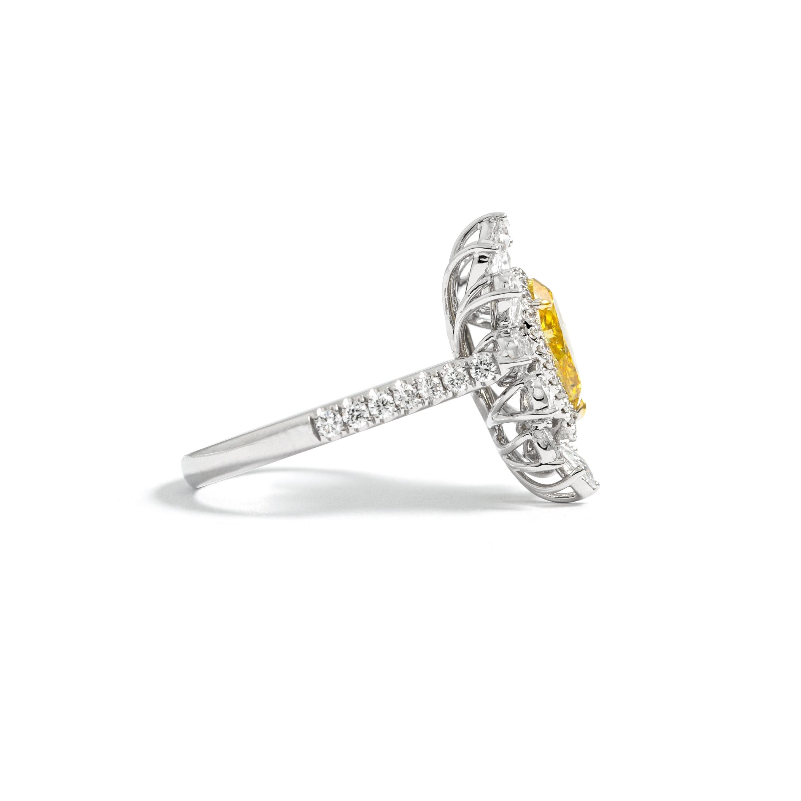 1.01 carat Fancy Deep Yellow Pear Fluo Medium Yellow, GIA report on 18K White Gold mounting ring.
Natural white diamond round 0.92 carat VS/G color.

