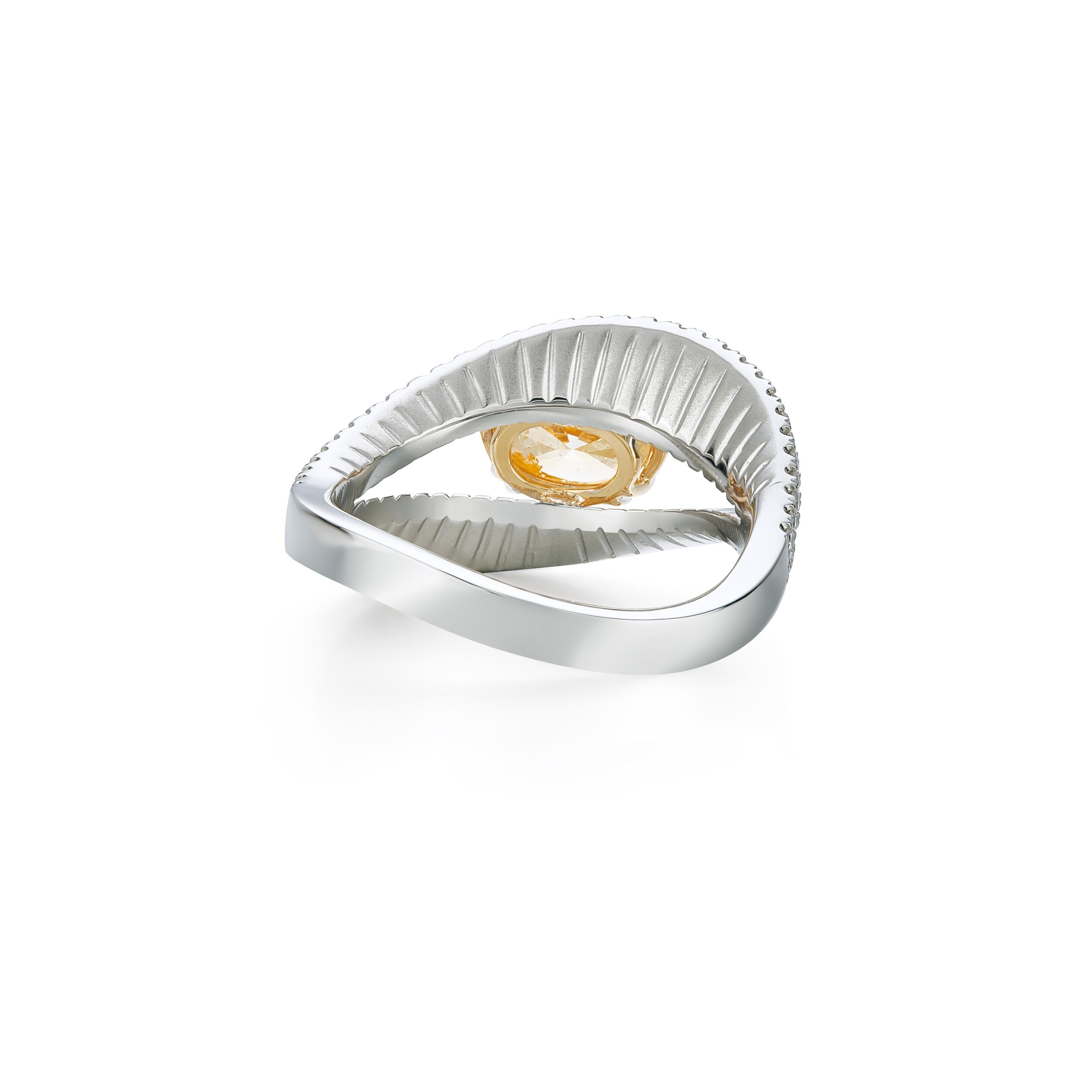 1.01 carat Fancy Intense Yellow Orange Diamond on 18K White Gold Ring. 
GIA certificate 2195625758.

Surrounded by round cut Diamonds white: 0.28 carat.
