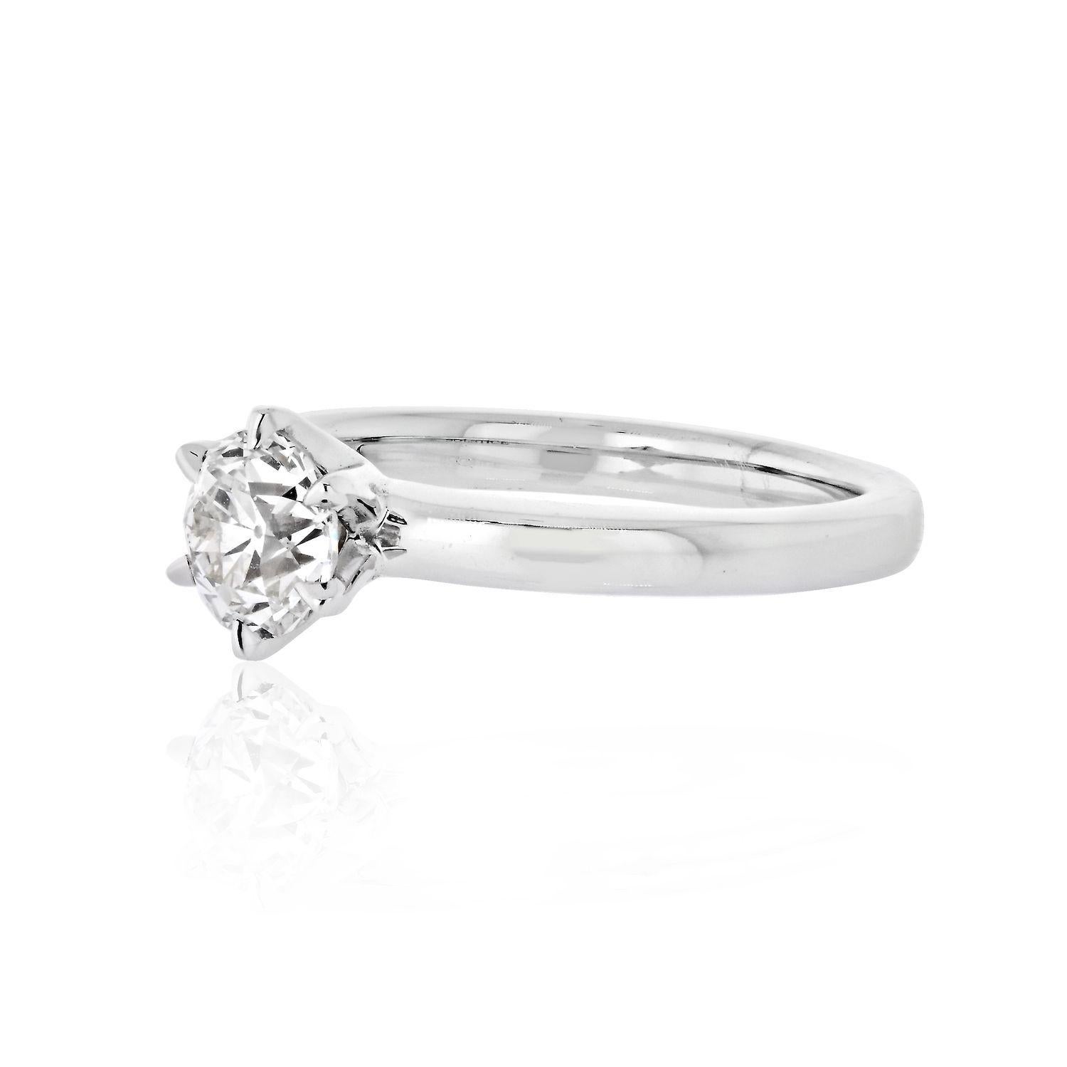 This solitaire style engagement ring is the perfect marriage of modern and vintage. It features a 1.01 carat Old European Cut diamond in a modern 14 karat, 2.5mm wide white gold setting. The diamond, has I color and VS2 clarity certified by GIA and