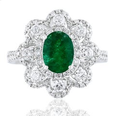 1.01 Carat Oval Emerald and Diamond Cocktail Flower Ring in 18K White Gold