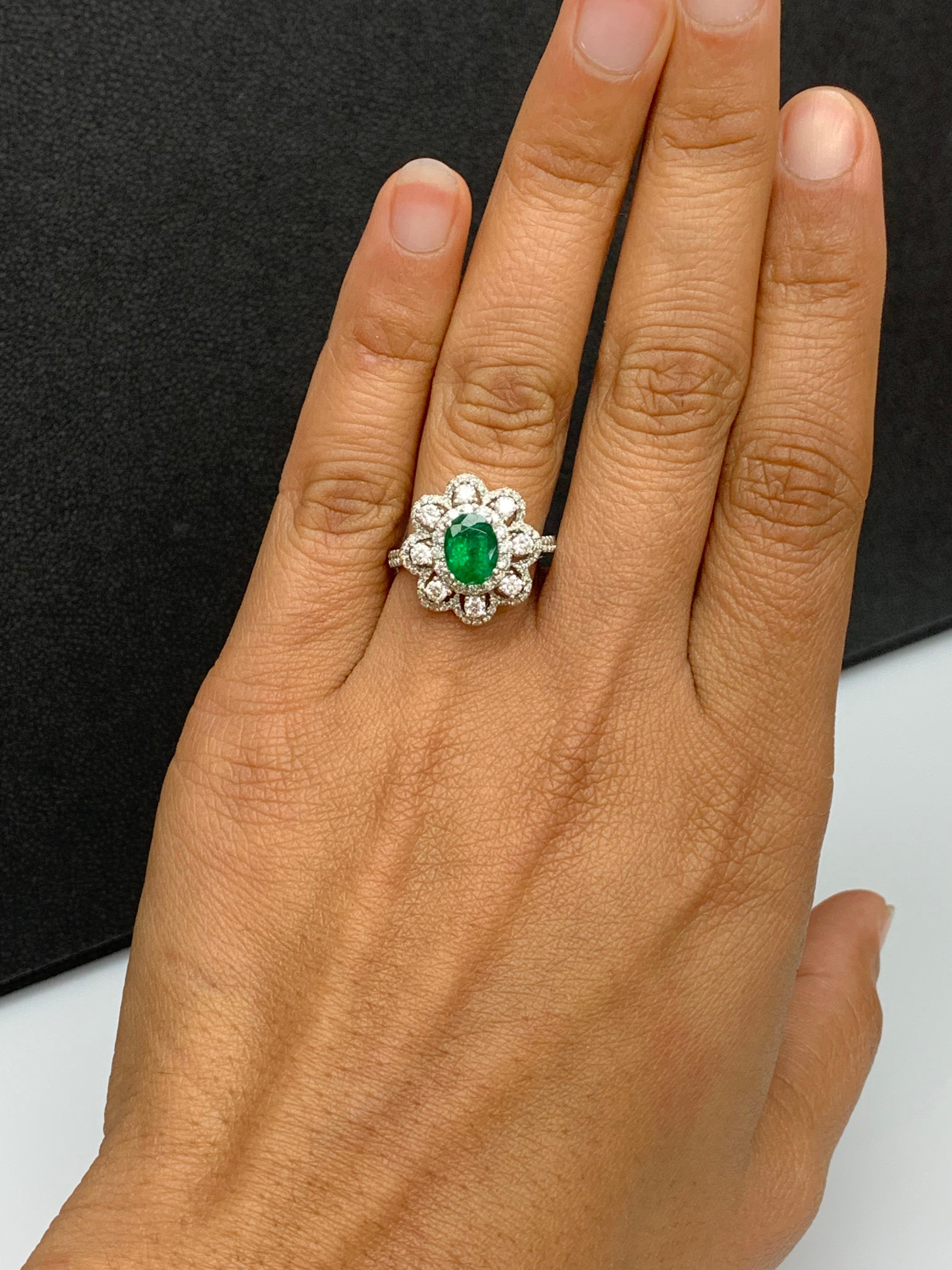 Modern 1.01 Carat Oval Emerald and Diamond Cocktail Flower Ring in 18K White Gold For Sale
