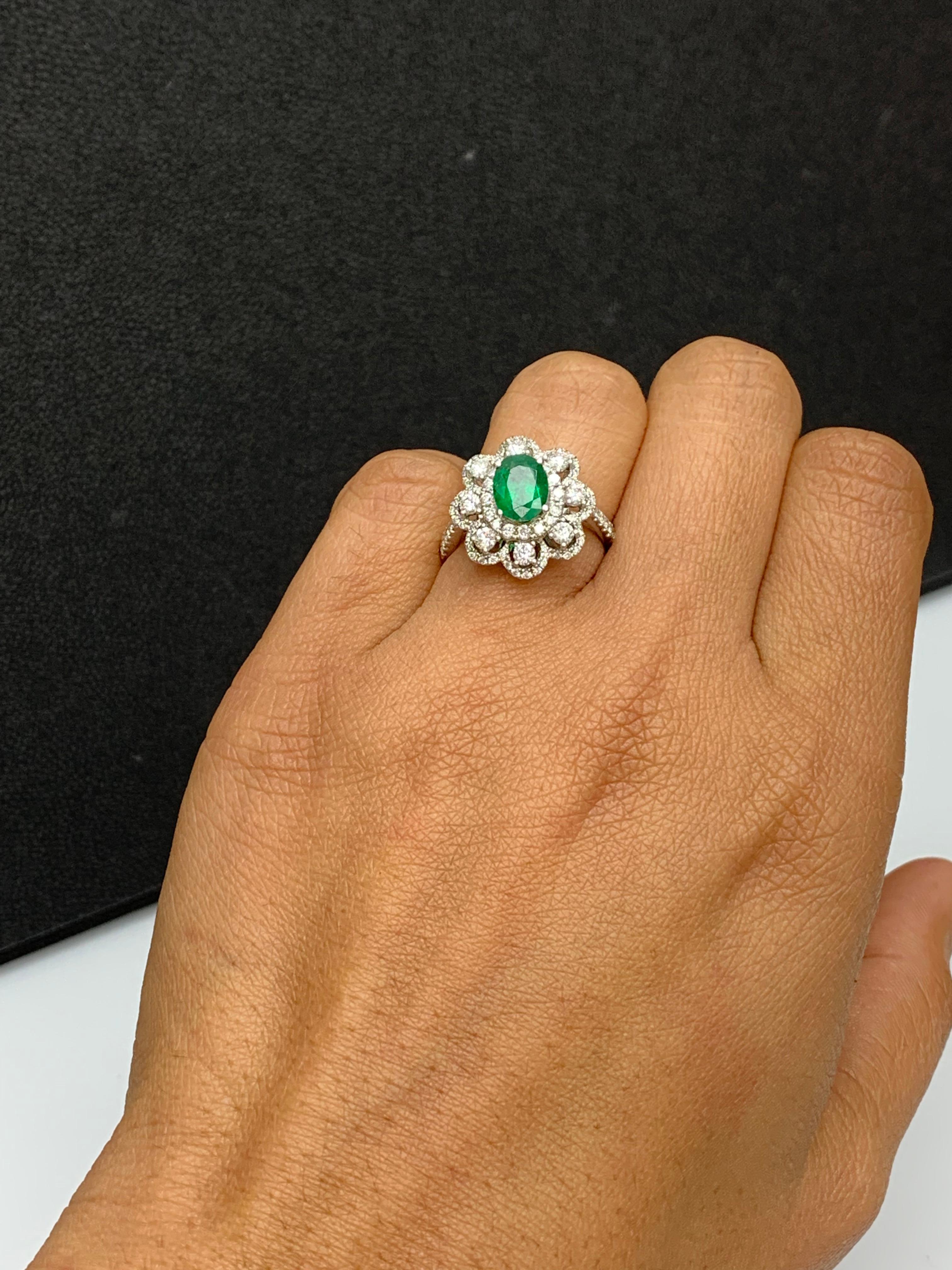 Oval Cut 1.01 Carat Oval Emerald and Diamond Cocktail Flower Ring in 18K White Gold For Sale