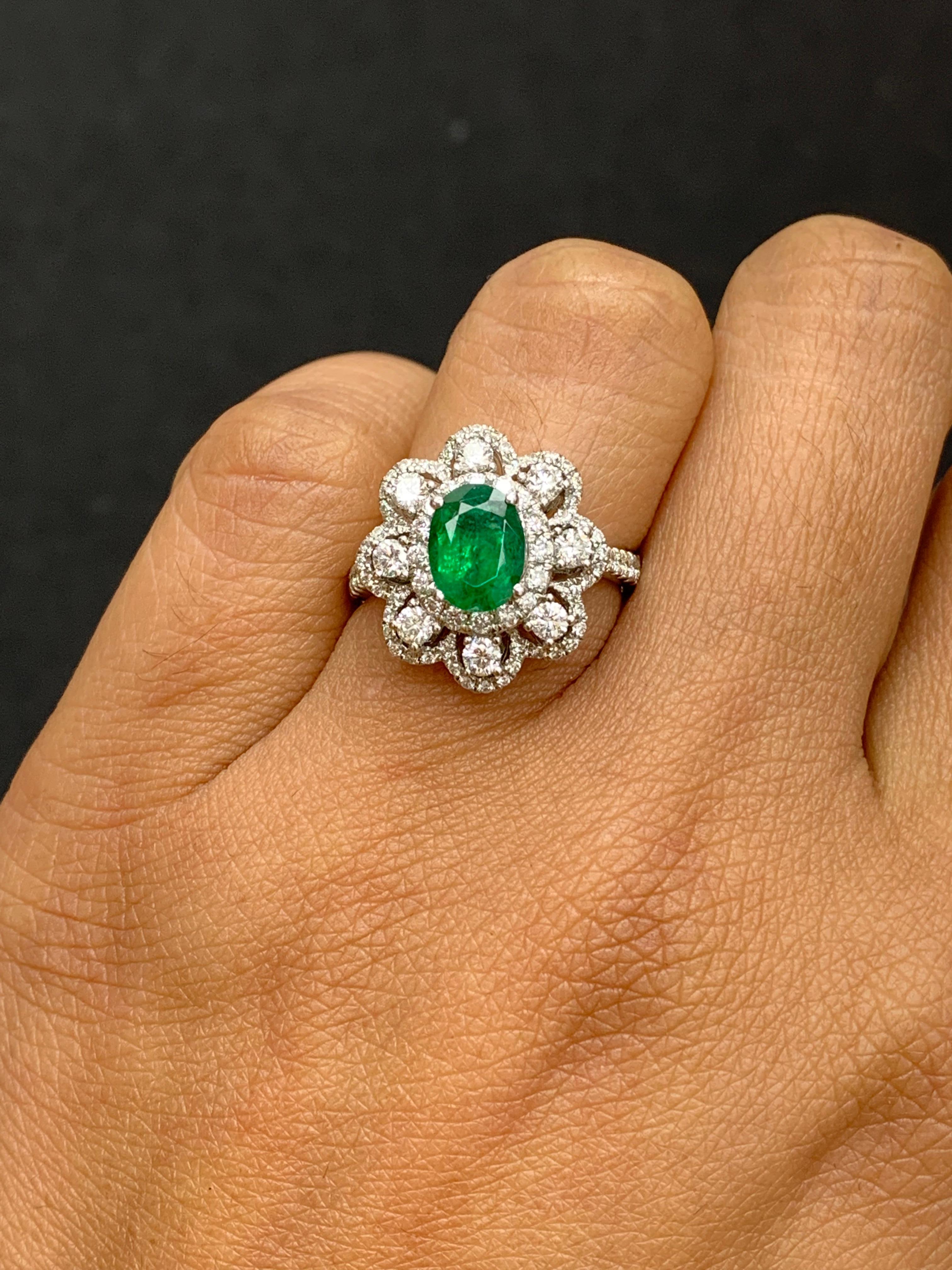 1.01 Carat Oval Emerald and Diamond Cocktail Flower Ring in 18K White Gold In New Condition For Sale In NEW YORK, NY