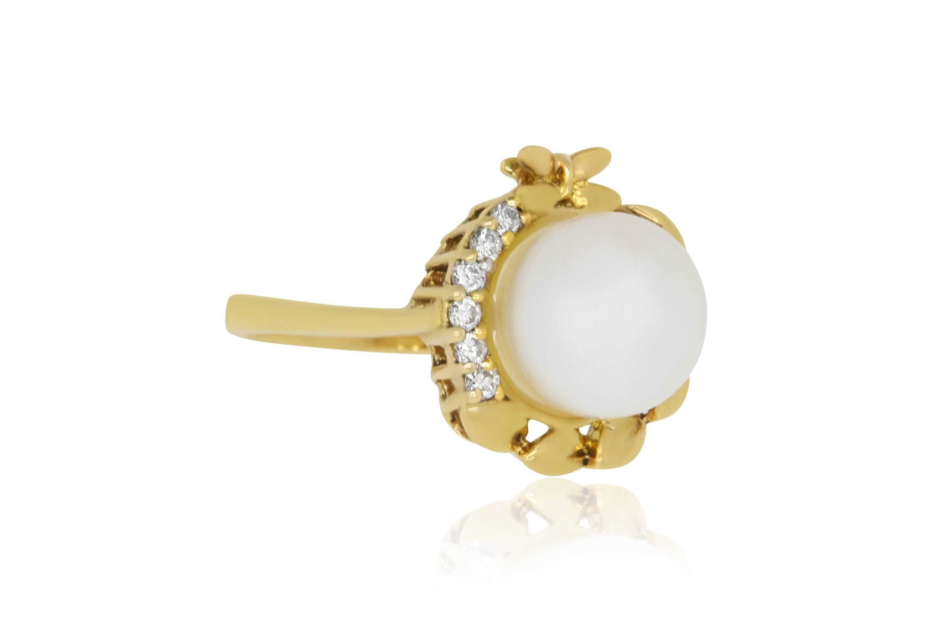 Material: 18k Yellow Gold 
Center Stone Details: 1.01 Carat Pearl 
Mounting Diamond Details: Brilliant Round White Diamonds Approximately 0.09 Carats - Clarity: VS-SI / Color: H-I
This piece measures approximately 14 millimeters.
Ring Size: Size