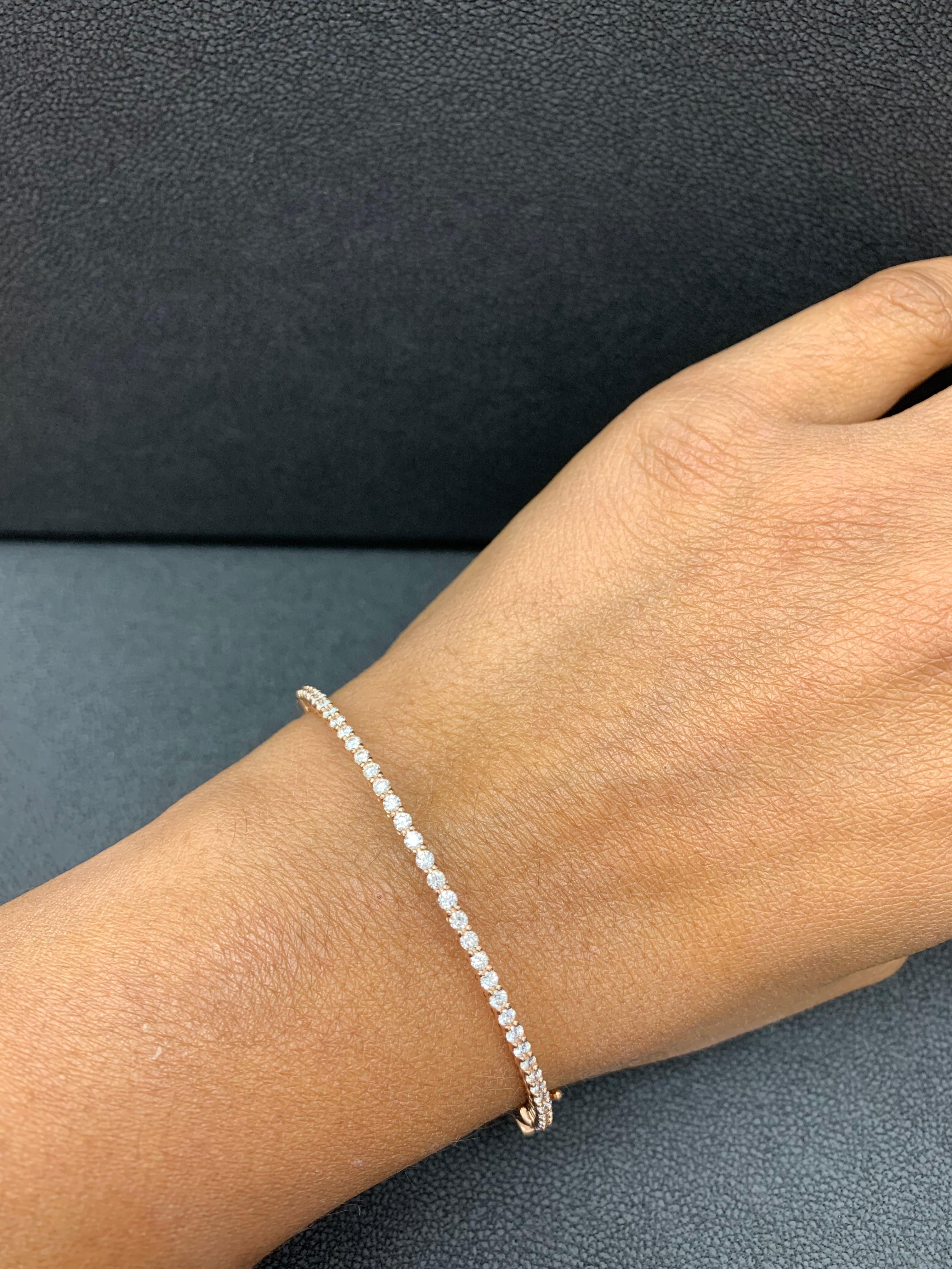 A simple but elegant bangle bracelet set with 39 round-cut diamonds weighing 1.01 carats total. Has a clasp to slip and wear the bangle securely. Made in 14k Rose Gold.

Style available in different price ranges. Prices are based on your selection