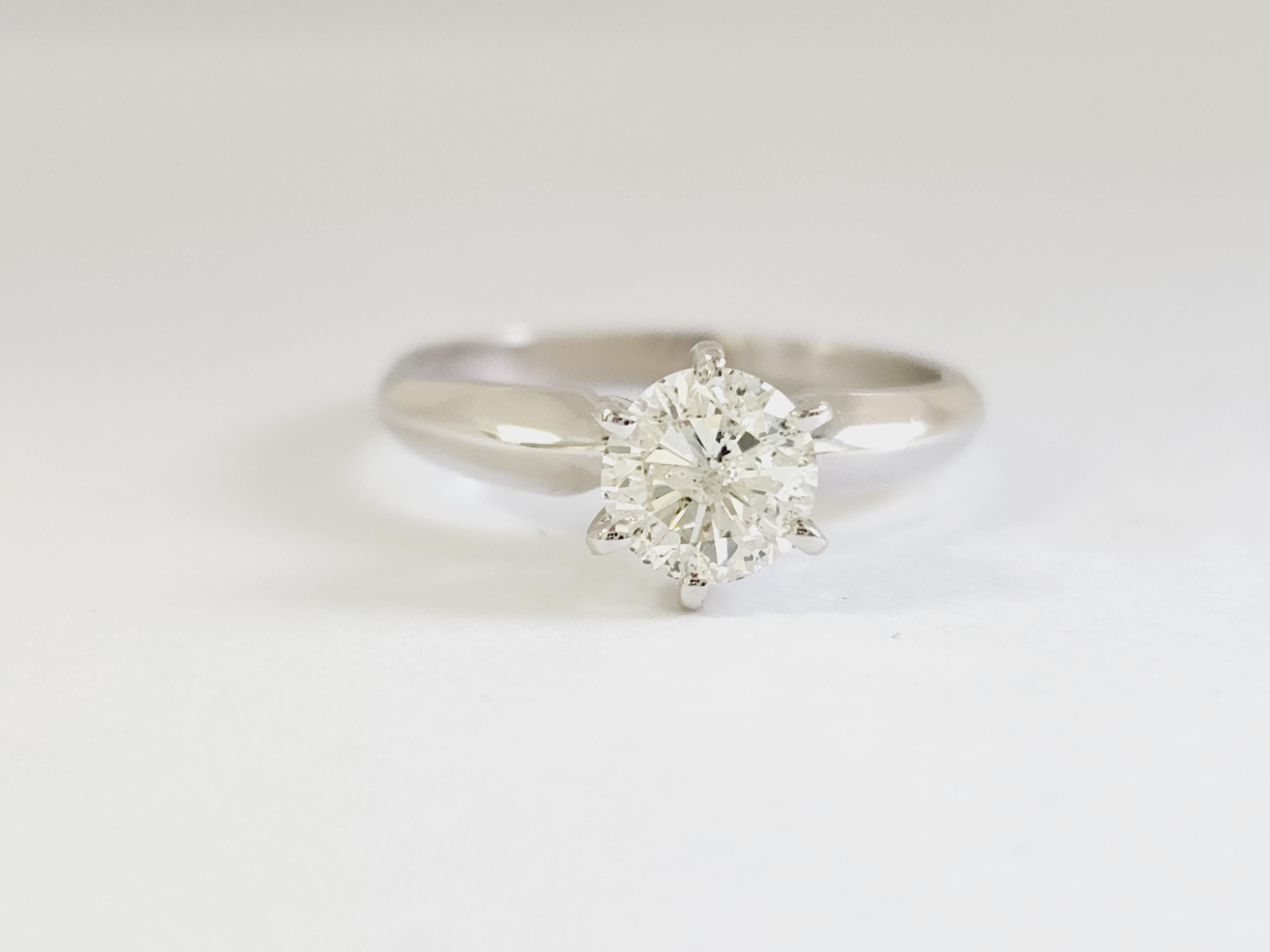 1.01 ct round brilliant cut natural diamonds. 6 prong solitaire setting, set in 14k white gold. Ring Size 7