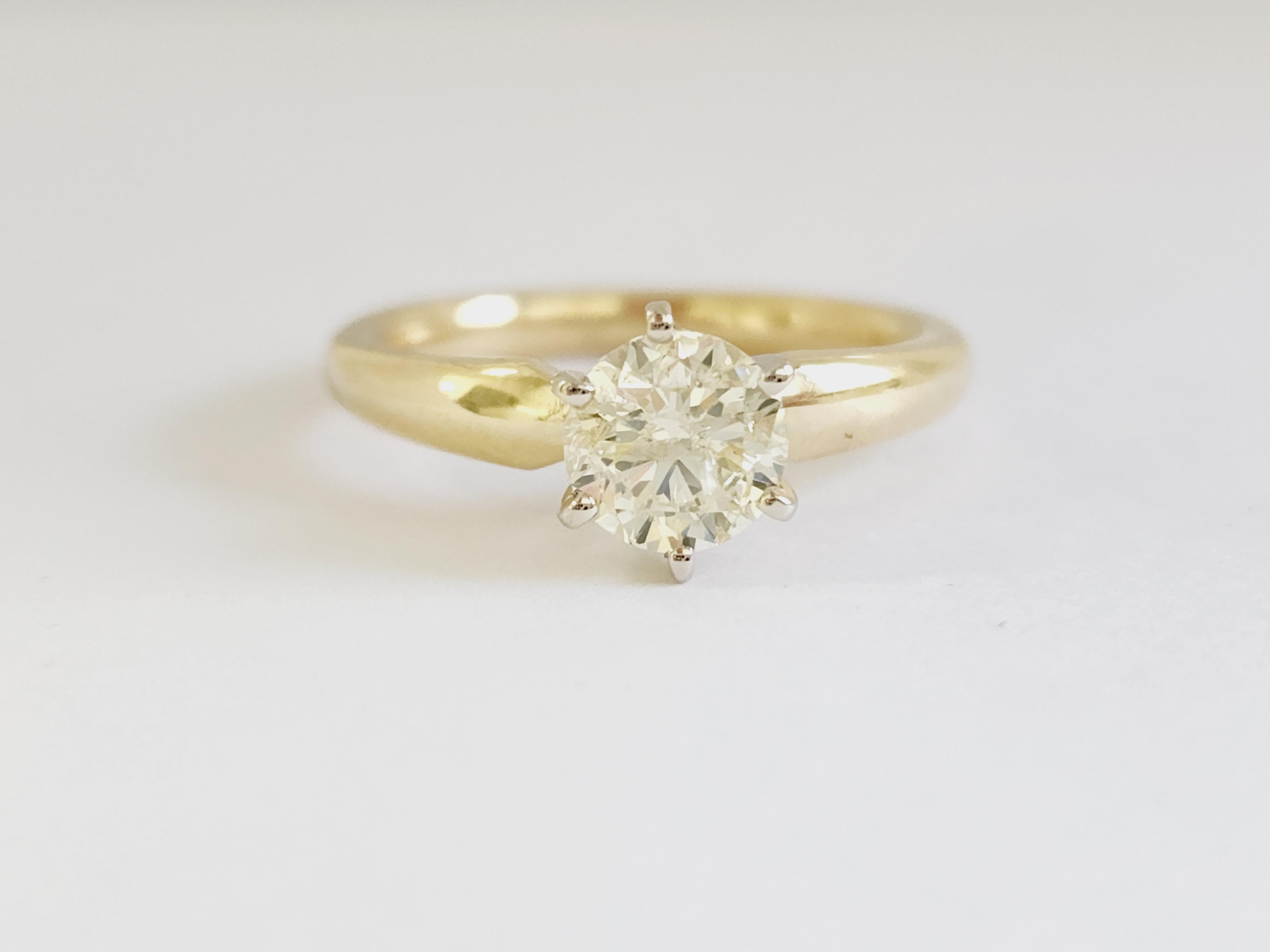 1.01 ct round brilliant cut natural diamonds. 6 prong solitaire setting, set in 14k yellow gold. Ring Size 6.5