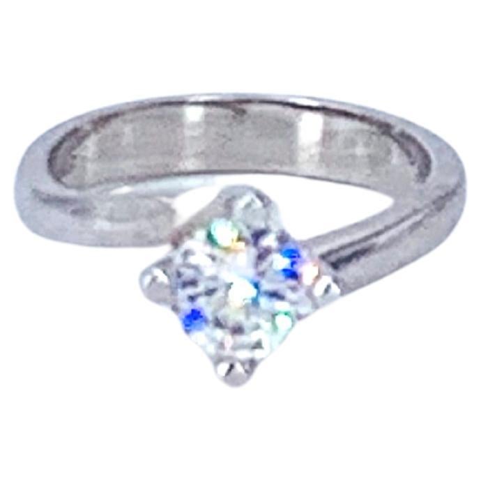This 1.01 Carat round Diamond Solitaire Engagement Ring is set in 18Kt white Gold.

For an engagement or purely a gift, it is a strikingly beautiful ring that dresses any hand with glamour and sparkle. 

The Diamond is slightly raised from the ring,