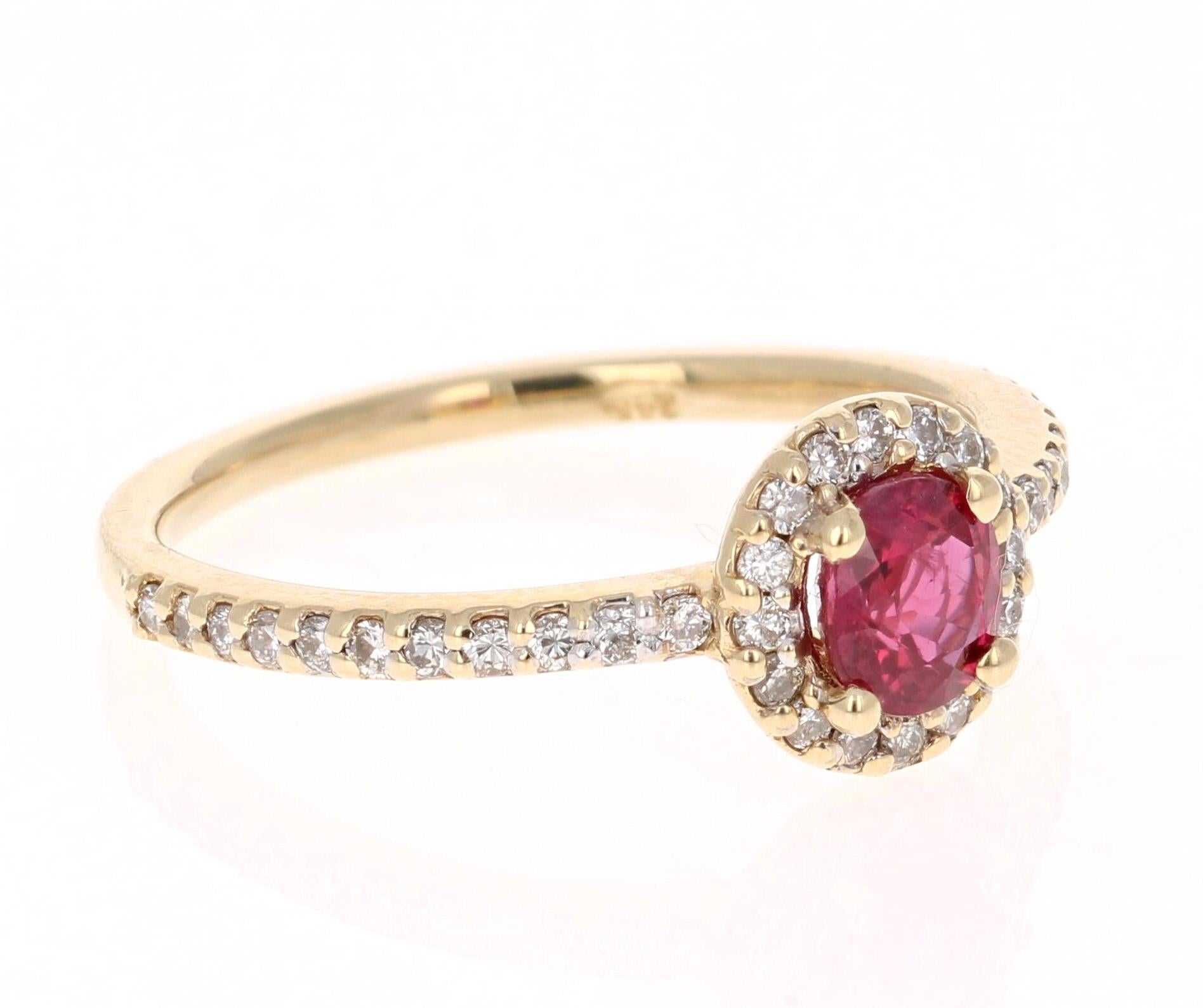 Simply beautiful Ruby Diamond Ring with a Round Cut 0.70 Carat Burmese Ruby which is surrounded by 38 Round Cut Diamonds that weigh 0.31 carats. The total carat weight of the ring is 1.01 carats. The clarity and color of the diamonds are VS-H.

The