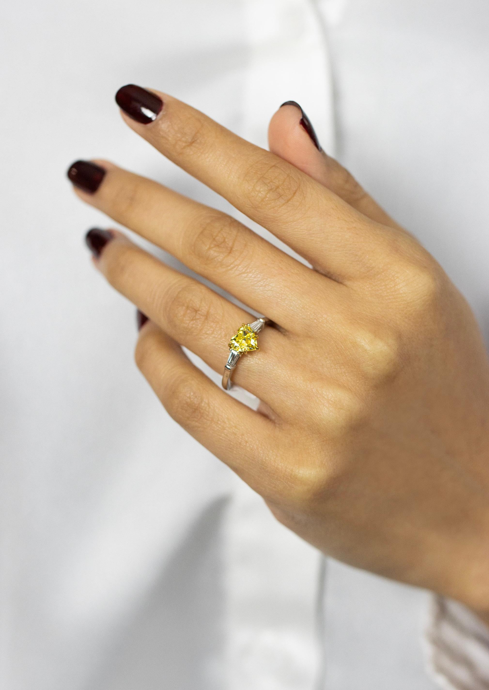 Women's 1.01 Carats Heart Shape Fancy Vivid Yellow Diamond Three Stone Engagement Ring For Sale