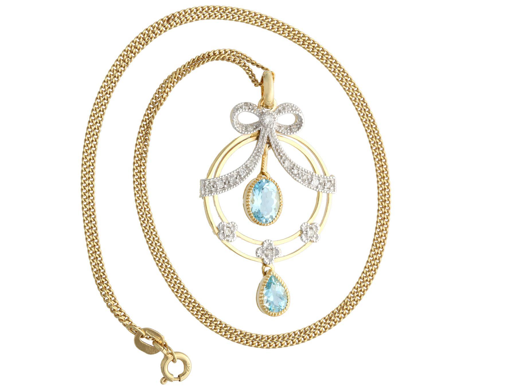 A fine and impressive contemporary 0.18 carat diamond and 1.01 carat aquamarine, 9 karat gold pendant in the antique style; part of our diverse antique jewelry collections.

This fine and impressive oval cut aquamarine pendant has been crafted in 9k