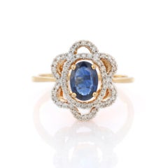 1.01 Ct Oval Blue Sapphire and Diamond Flower Wedding Ring in 18K Yellow Gold