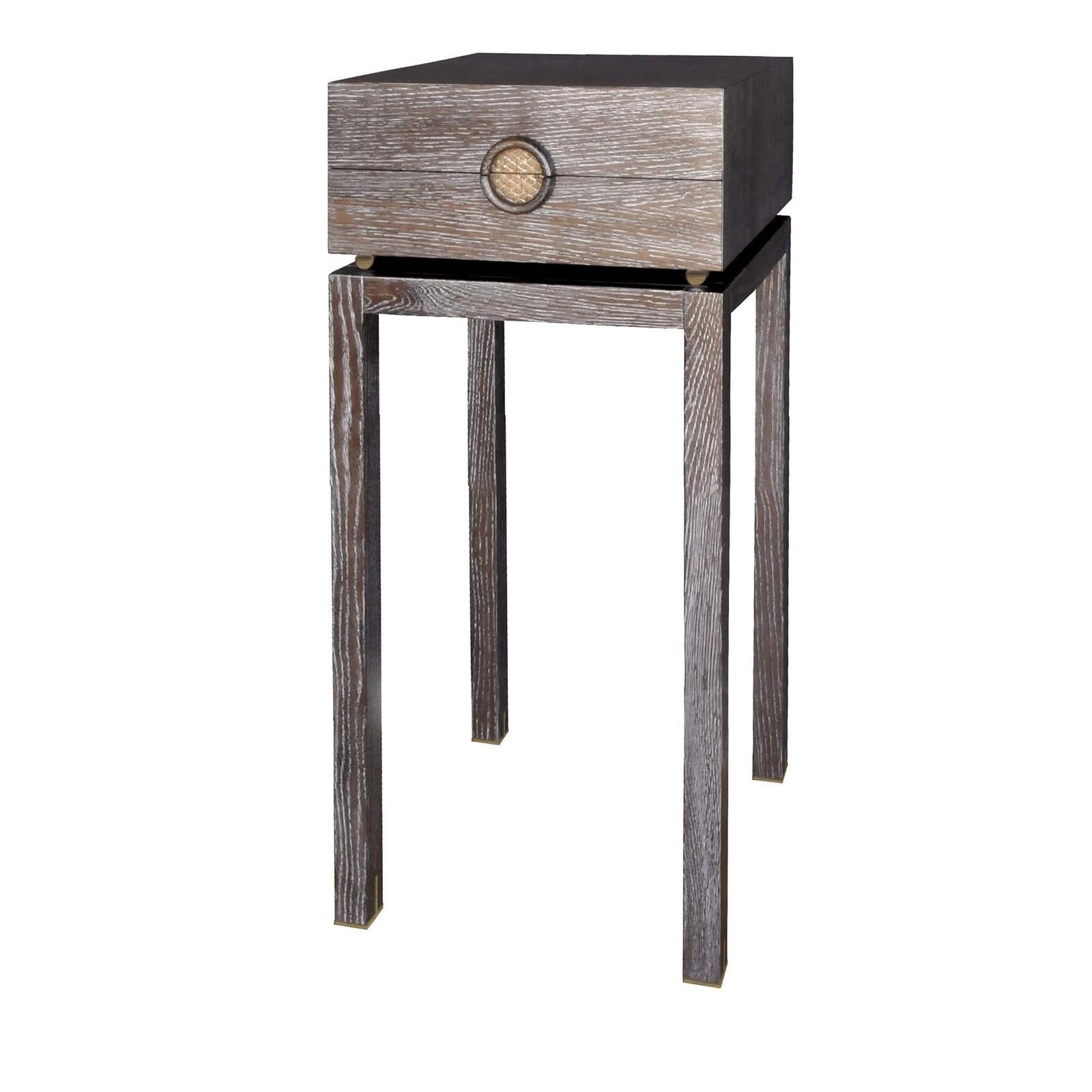 Either as a nightstand or sidled up beside a sofa, this tall table makes a stylish statement with its simple and sleek silhouette crafted of stained oak in silver and chocolate brown. Galvanized bronze spacers suspend the top from the four-legged