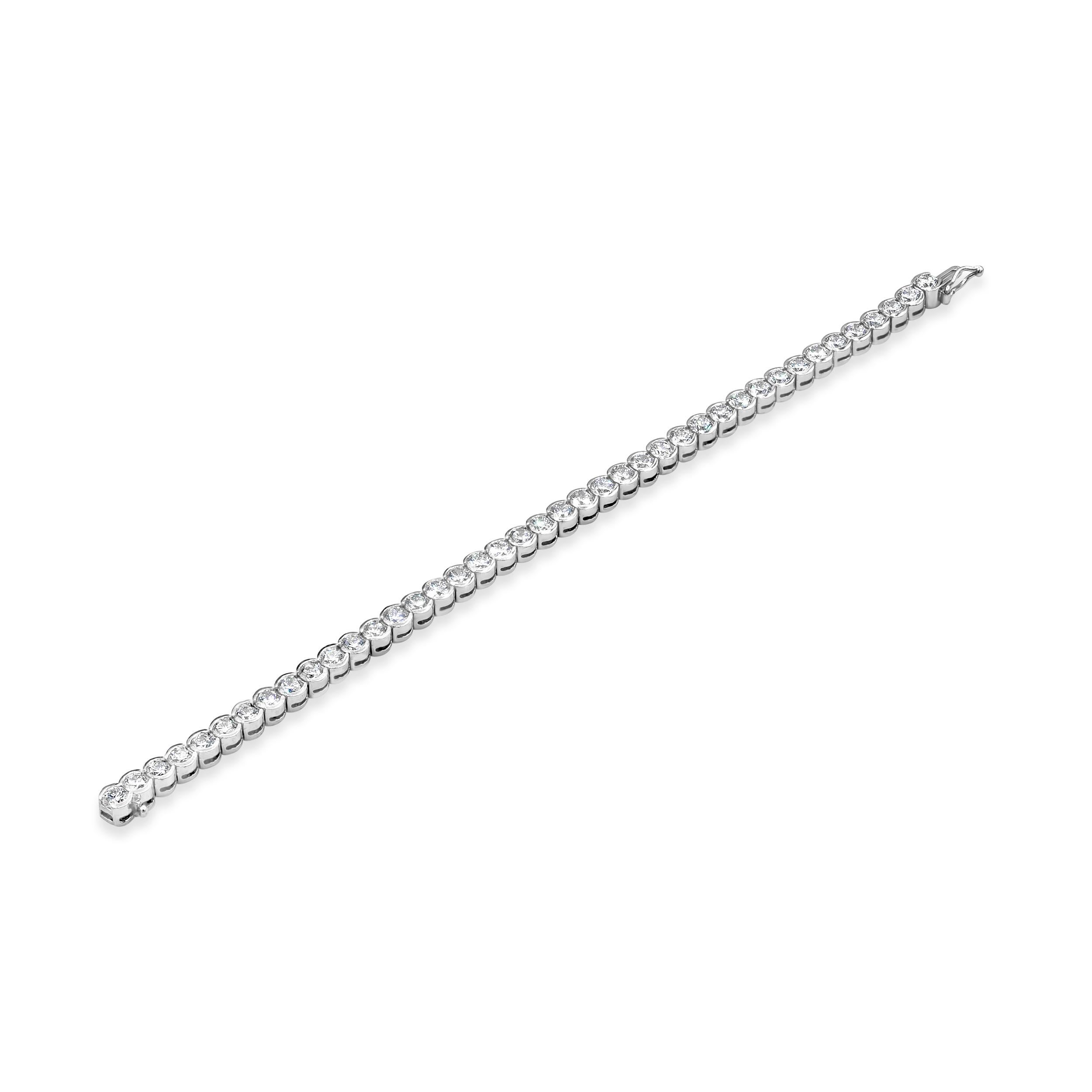 A brilliant tennis bracelet showcasing a row of round brilliant diamonds. Diamonds weigh 10.10 carats total set in a half-bezel mounting. Made with Platinum. 7 inches in Length. 

E-F COLOR
VS CLARITY

Style available in different price ranges.