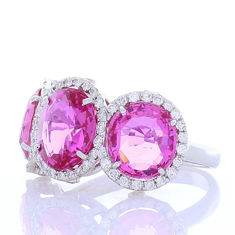 This vintage inspired ring features a trio of pink sapphires & provides a distinctive design. The vivid natural pink sapphires are captivating and joyful. Their transparency, clarity, and luster are excellent. The total weight of these vivid pink