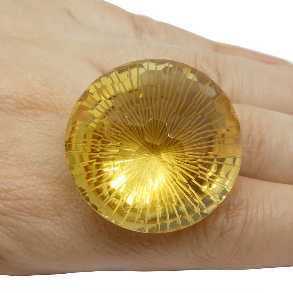 Description:

Gem Type: Citrine
Number of Stones: 1
Weight: 101.17 cts
Measurements: 32.55 x 32.20 x 19.80 mm
Shape: Round
Cutting Style Crown: Honeycomb
Cutting Style Pavilion: Brilliant Cut
Transparency: Transparent
Clarity: Very Very Slightly