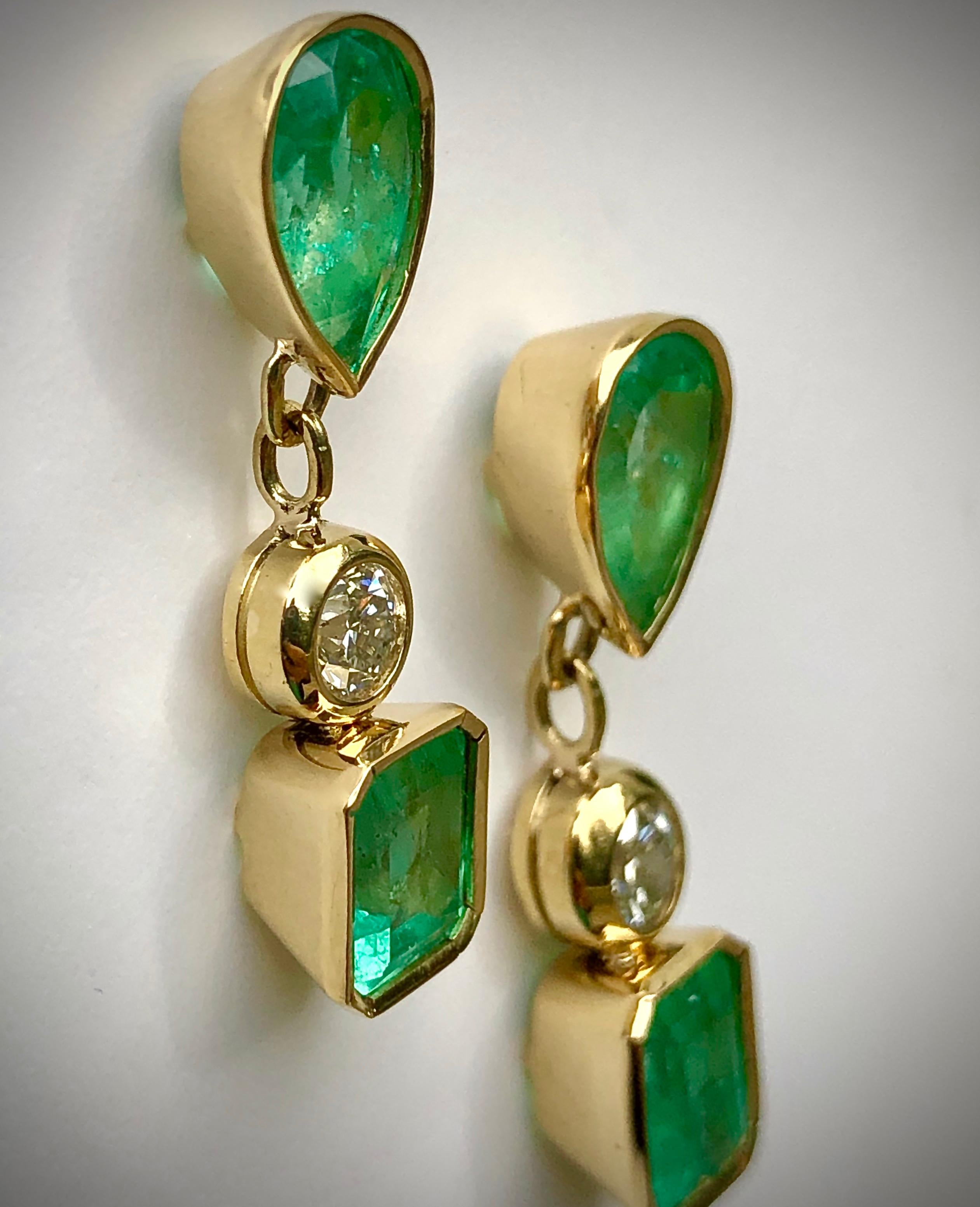 Magnificent 10.12 Carat Natural Colombian Emerald and Diamond Drop Dangle Earrings 18K Yellow Gold
Primary Stones: 100% Natural Colombian emerald
Shape or Cut Emerald : Emerald Cut & Pear Cut 
Color/Clarity : Brilliant Medium 100% NATURAL Green