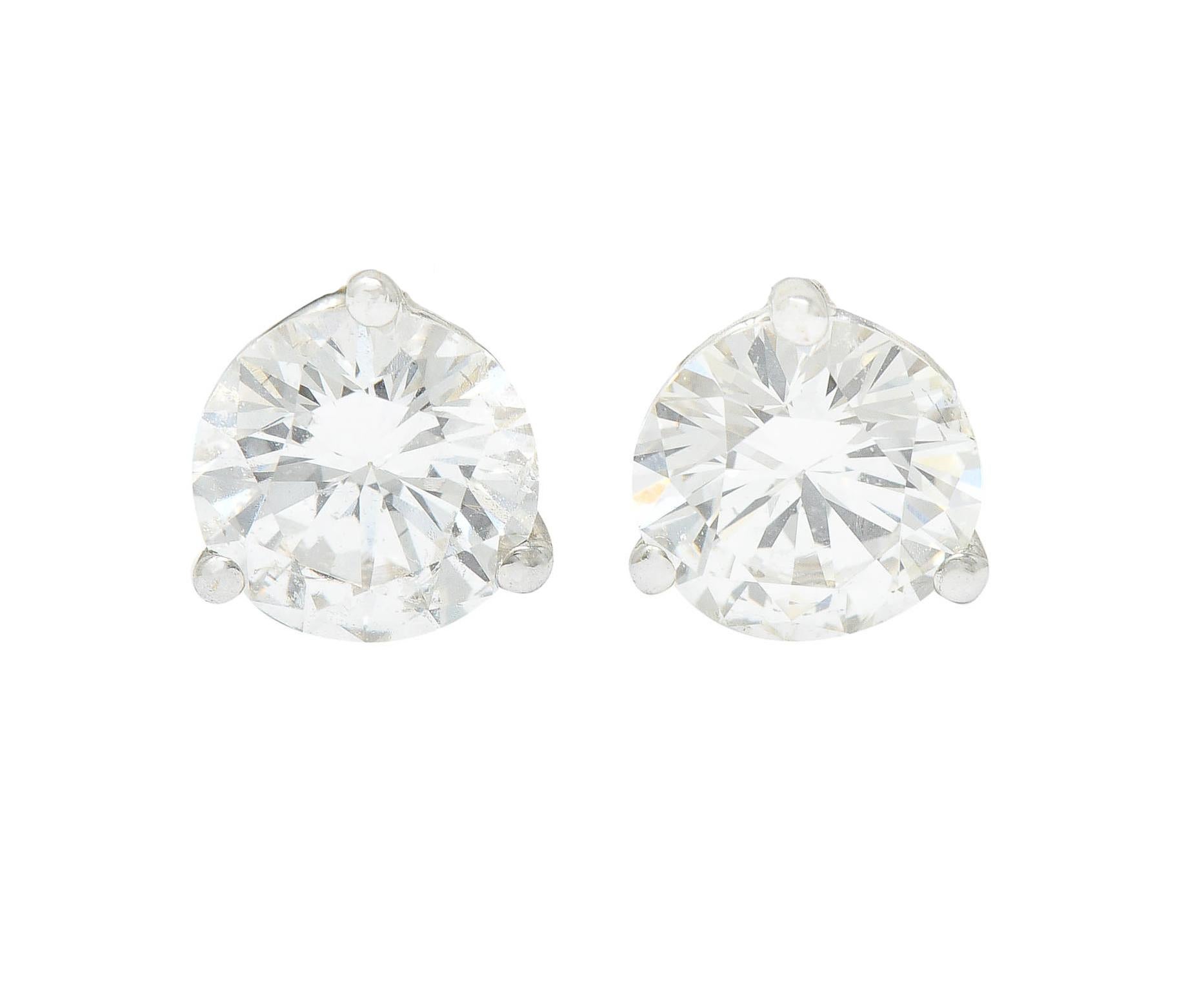 Featuring martini basket stud earrings set with round brilliant cut diamonds

Weighing in total approximately 1.20 carats with I/J color and SI clarity

Completed by threaded posts and screw backs

With stud enhancers as a flange surmount that