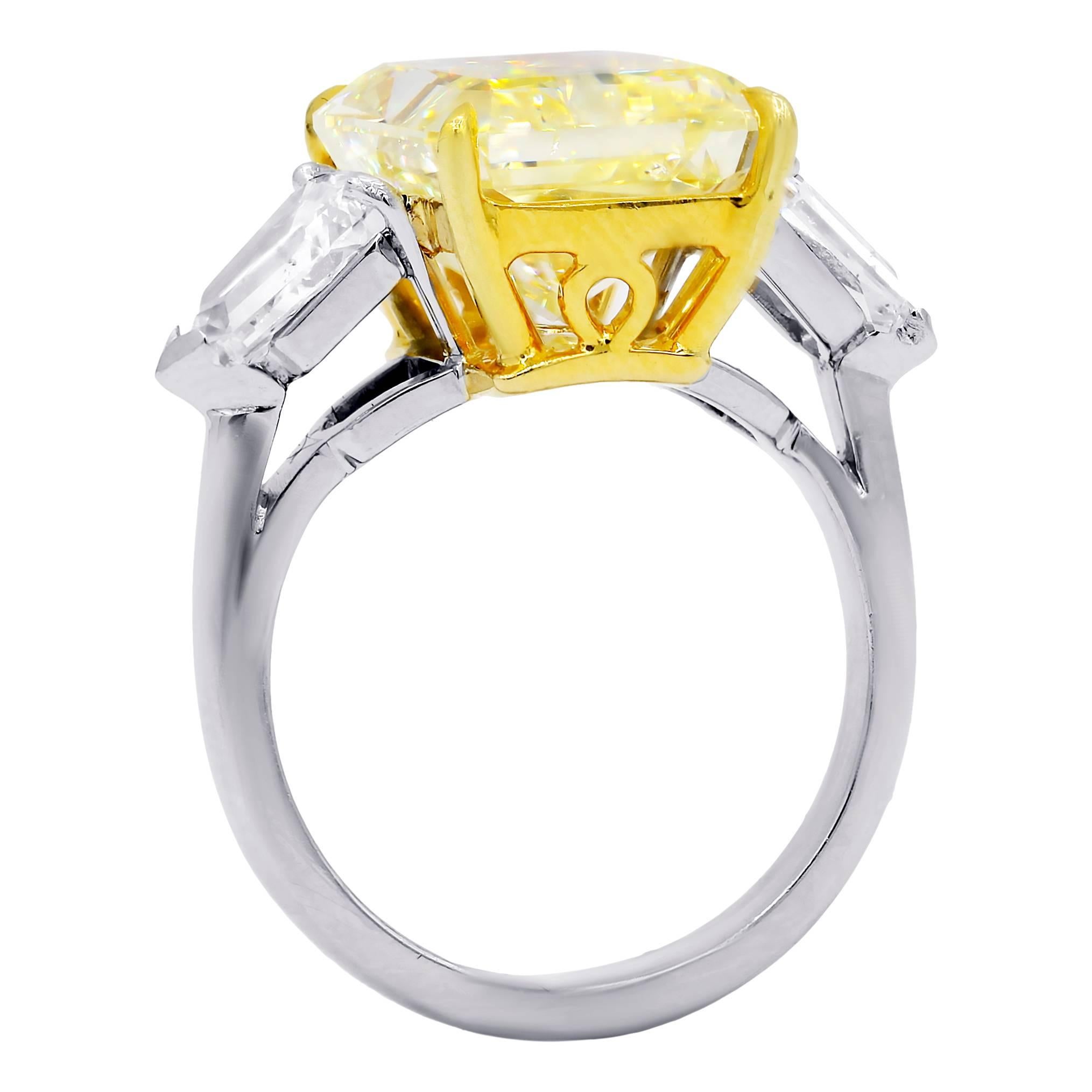 Magnificent Three stone Canary Yellow Diamond ring, features 10.15 carats Fancy Yellow, SI2 in Clarity. 100% Eye clean no visible inclusions. Set with 1.80 Carats of Bullets in Platinum GIA #17480434

