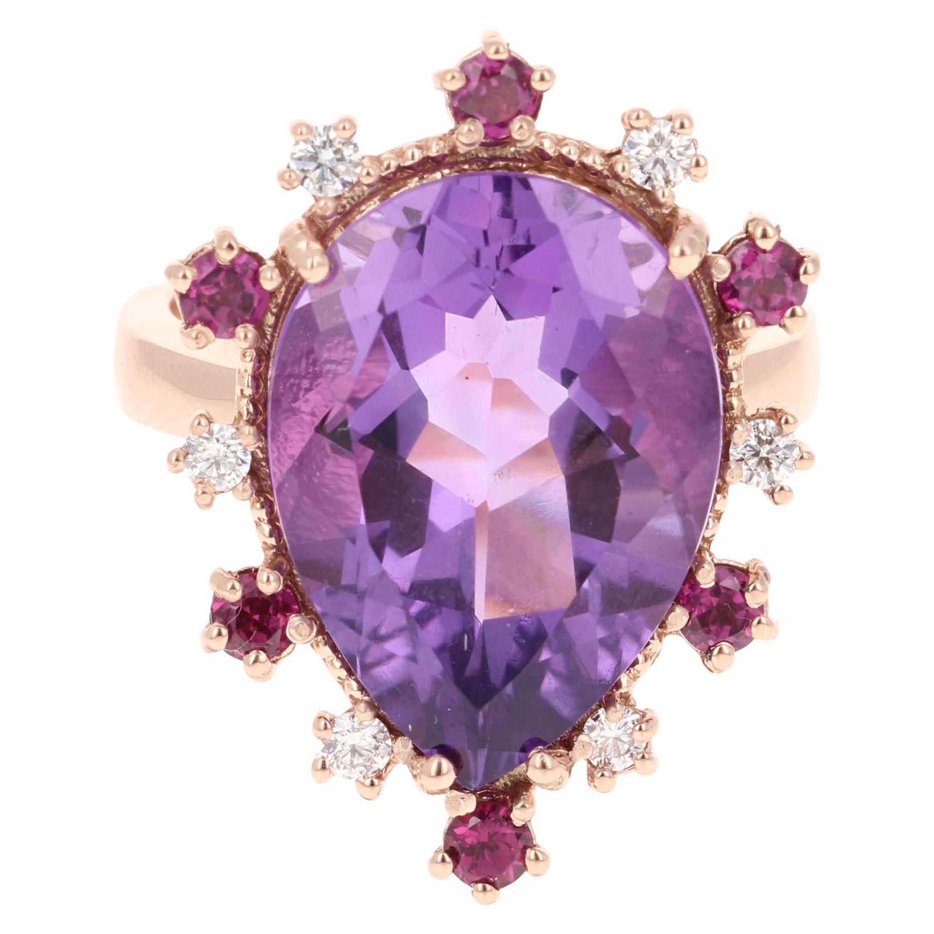 10.16 Carat Amethyst Garnet Diamond Rose Gold Cocktail Ring

This ring has a Pear Cut Amethyst that weighs 9.35 Carats and is embellished with 6 Round Cut Purple Garnets that weigh 0.61 Carats as well as 6 Round Cut Diamonds that weigh 0.20 Carats