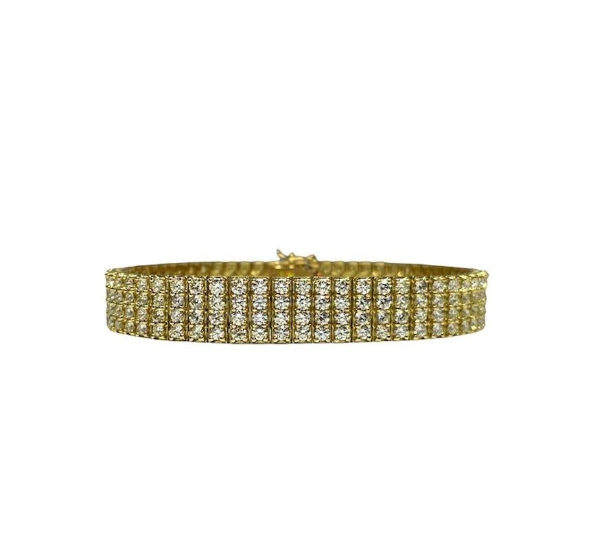 Very well-made 18k yellow gold mesh bracelet. The bracelet features round brilliant cut diamonds weighing 10.16 cts (stamped weight) graded E-F in color and VVS2-VS1 in clarity. 