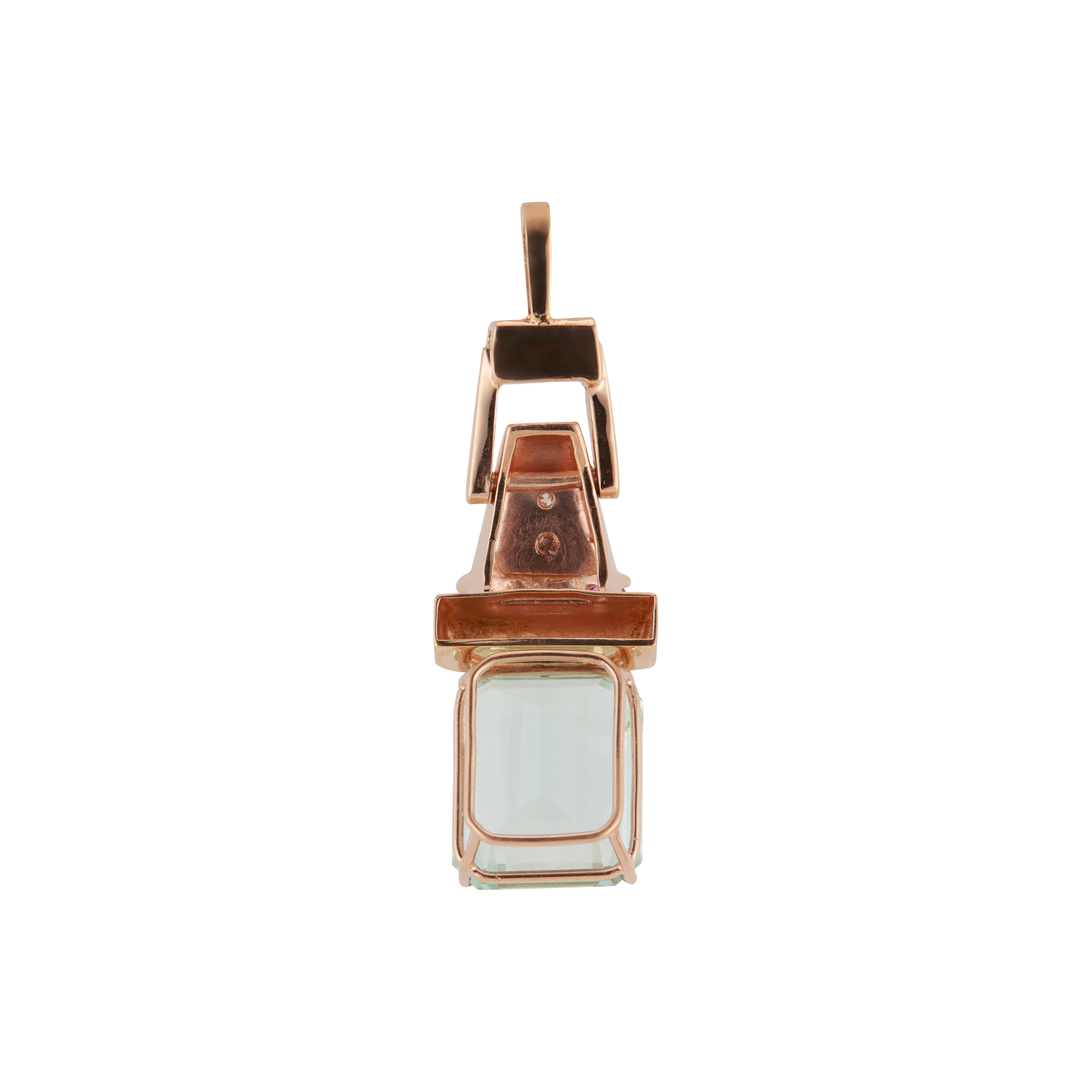 Original Retro Art Deco handmade hinged pendant in 14k rose and white gold. 10.17 emerald step cut aquamarine accented with four rubies and 6 round diamonds, white gold under the diamonds. On Peter's now famous pink gold scale of 1 to 10 with 10 as