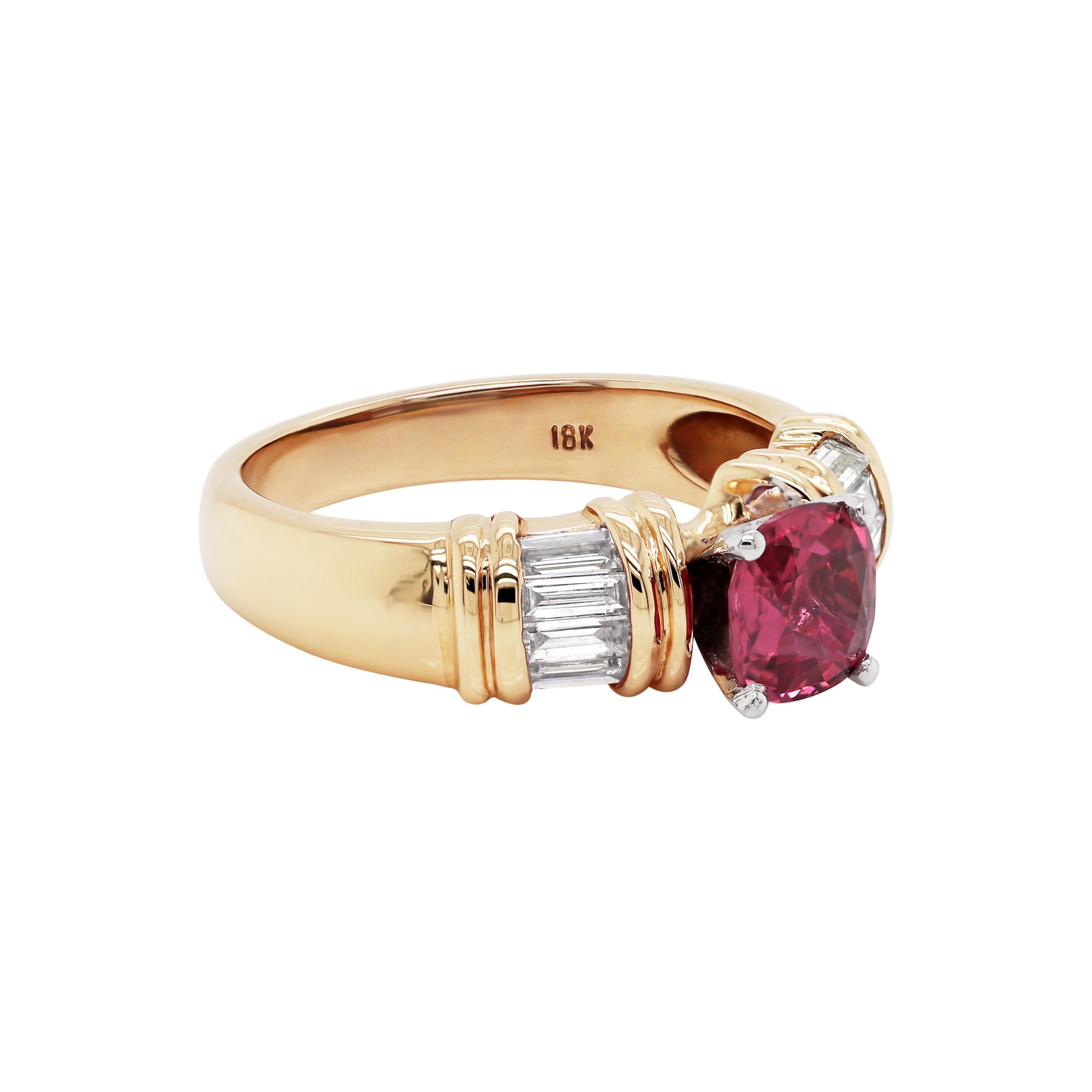 Beautiful 18 carat yellow gold ring featuring a cushion shaped pink sapphire in the centre, weighing a total of 1.01 carats, mounted in a four claw, open back setting. The sapphire is accompanied by four  channel set baguette cut diamonds on either