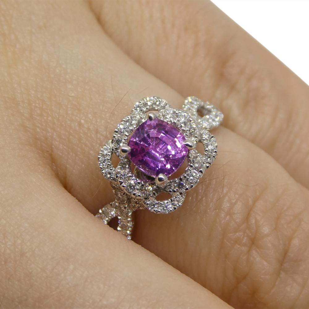 
Introducing our exquisite Pink Sapphire and Diamond Ring, a radiant symbol of grace and sophistication. At its center gleams a captivating cushion-cut pink sapphire, weighing 1.01 carats. This sapphire boasts transparent clarity, exuding a