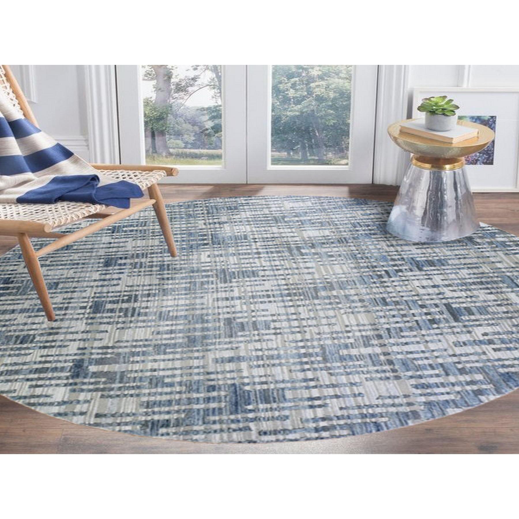 This is a truly genuine one-of-a-kind Hand Knotted Blue Pure Silk and Textured Wool Round Zigzag with Graph Design Oriental Rug. It has been woven for months and months in the centuries-old Persian weaving craftsmanship techniques by expert