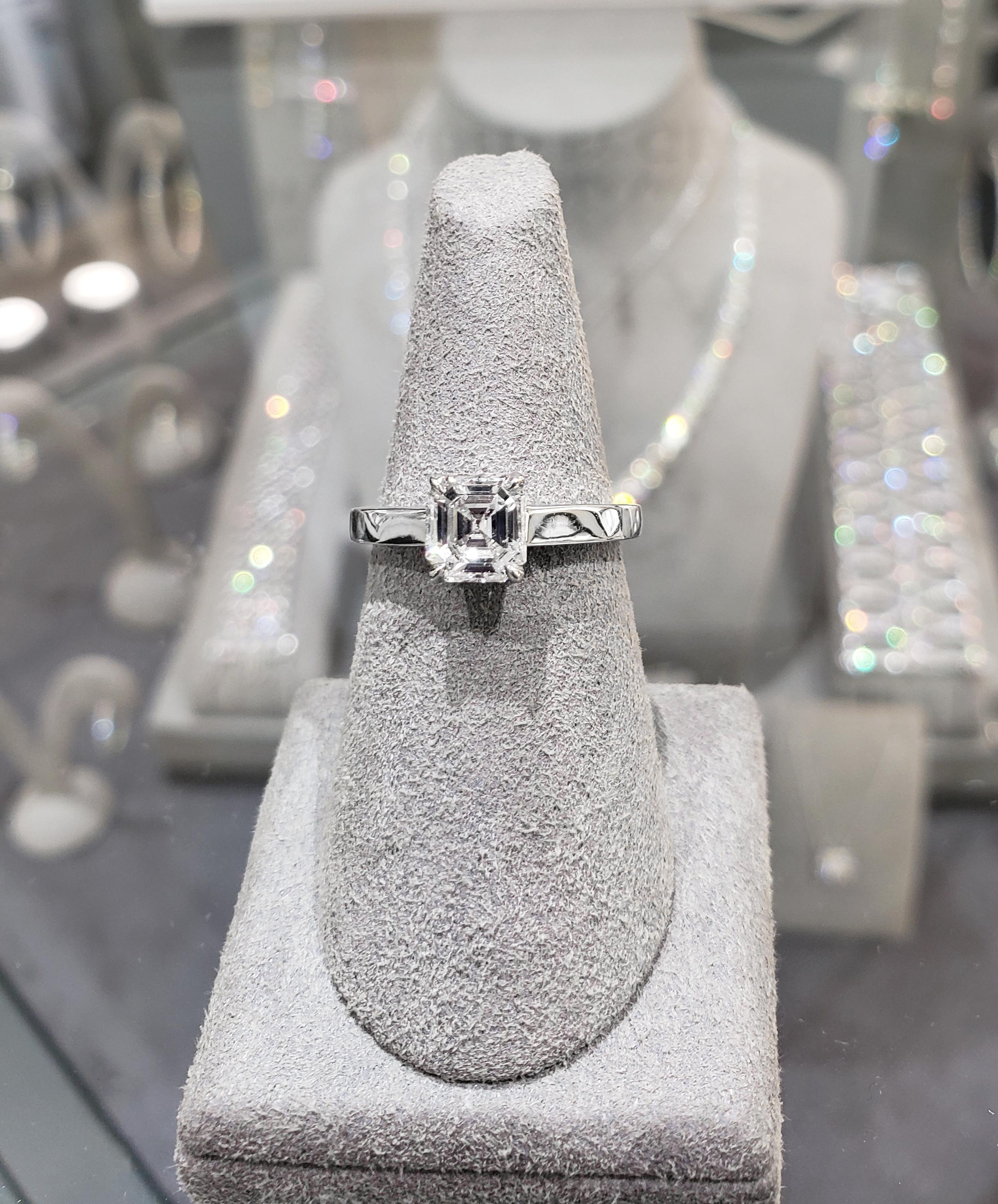 Simplicity and class at it's finest. Showcases a single 1.02 carat asscher cut diamond elegantly set in a angular platinum composition. 

