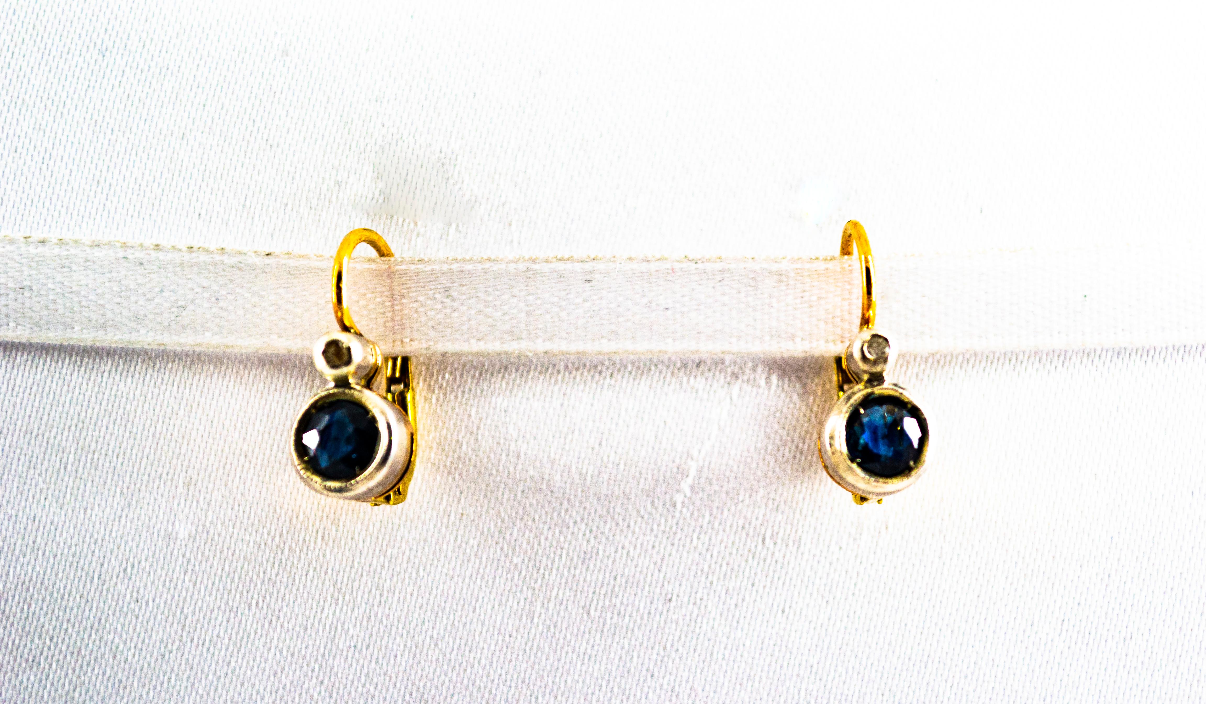 These Lever-Back Earrings are made of 9K Yellow Gold and Sterling Silver.
These Earrings have 0.02 Carats of White Rose Cut Diamonds.
These Earrings have also 1.00 Carat of Blue Sapphires.
These Earrings are available also with Rubies or