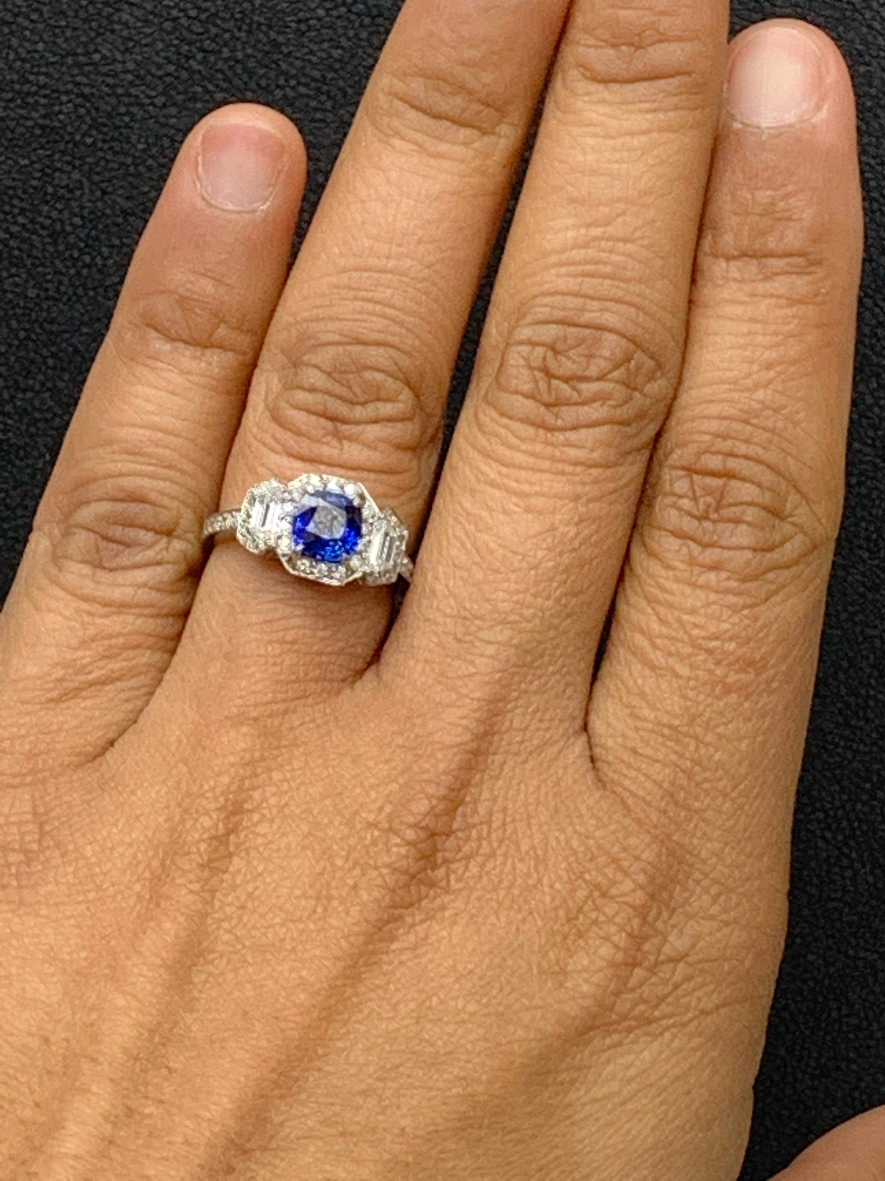 1.02 Carat Cushion Cut Sapphire and Diamond Three-Stone Halo Ring in Platinum In New Condition For Sale In NEW YORK, NY