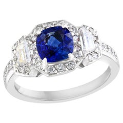 1.02 Carat Cushion Cut Sapphire and Diamond Three-Stone Halo Ring in Platinum