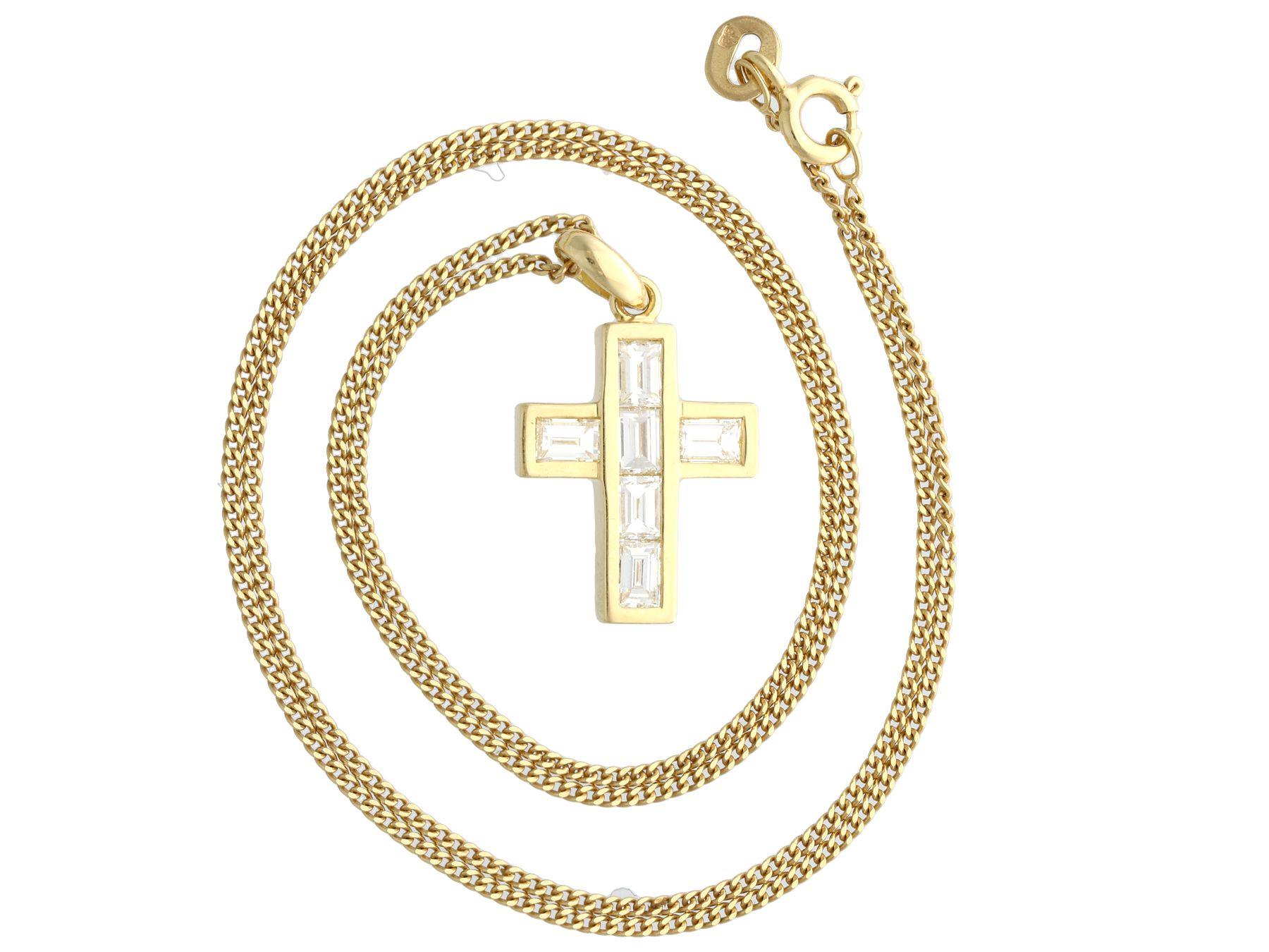 A fine and impressive contemporary 1.02 carat diamond and 18k yellow gold cross pendant; part of our diverse diamond jewellery and estate jewelry collections.

This fine and impressive contemporary diamond pendant has been crafted in 18k yellow