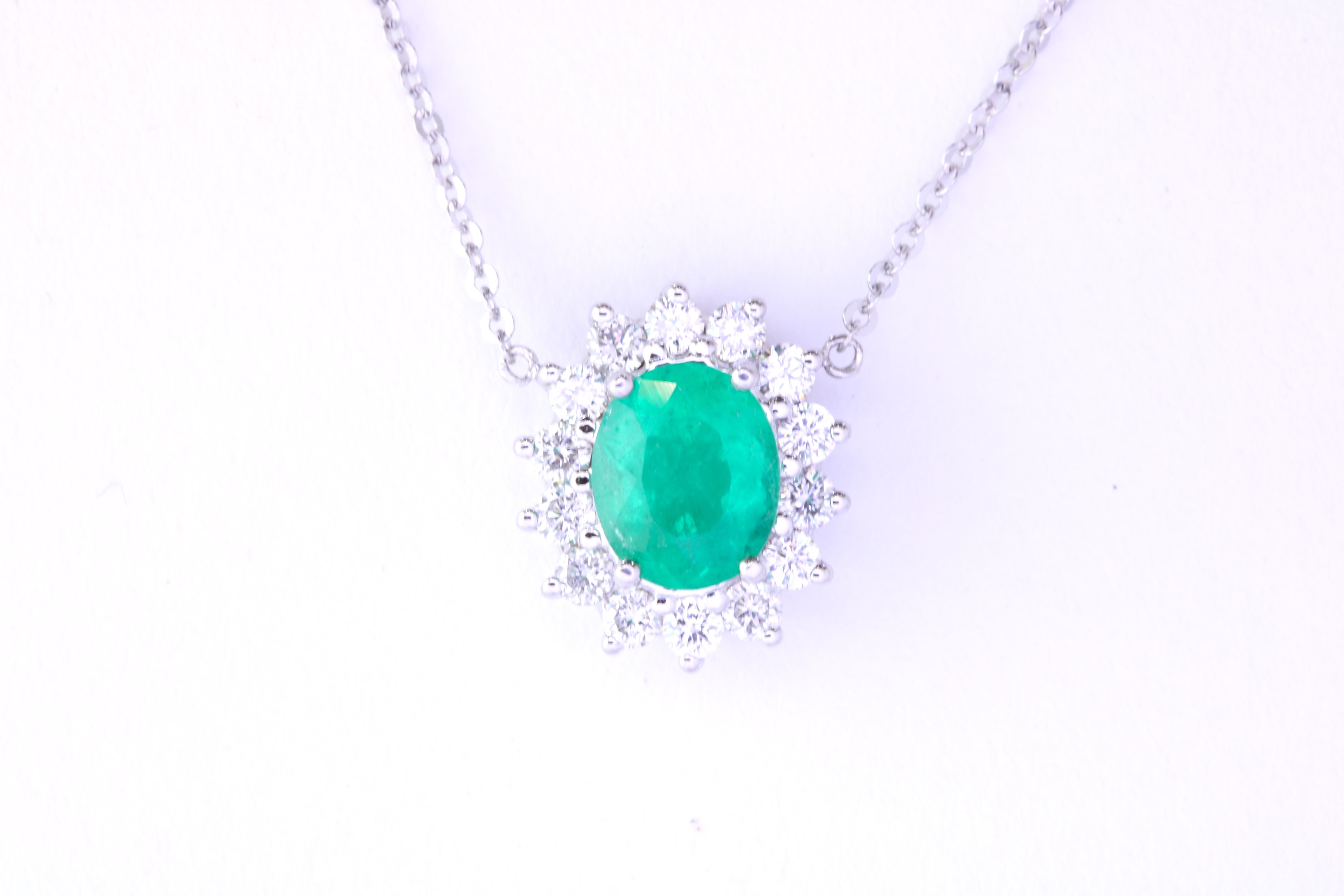 Add a pop of color to your jewelry collection with this 1.02 Carat Emerald necklace. Circled in 14 sparkling White Diamonds, this pendant is suspended by an 18-inch chain.  

Material: 14k White Gold 
Stone Details: 1 Oval Cut Emerald at 1.02