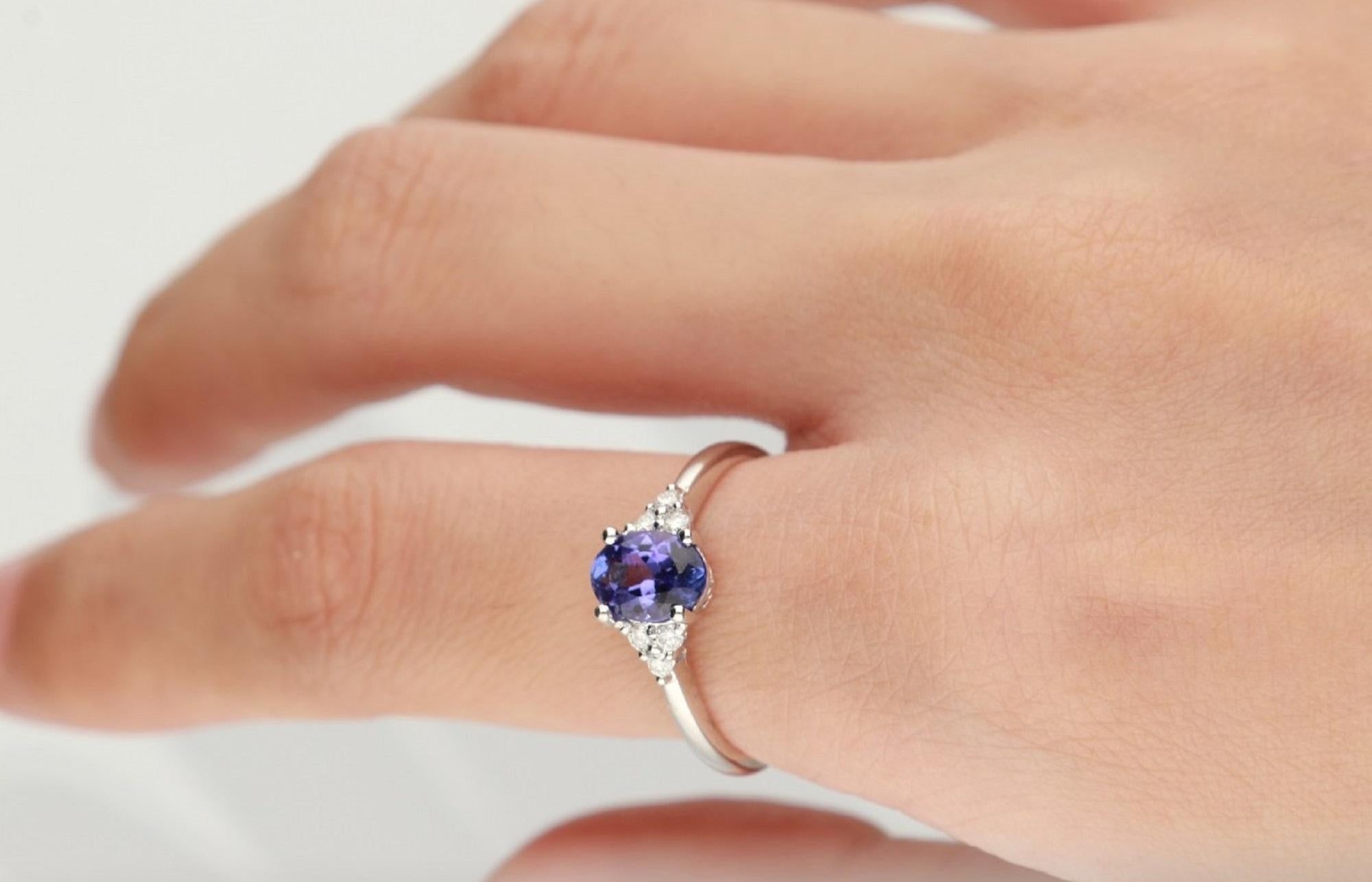 Stunning, timeless and classy eternity Unique Ring. Decorate yourself in luxury with this Gin & Grace Ring. The 14k White Gold jewelry boasts Oval-Cut Prong Setting Genuine Tanzanite (1 pcs) 1.02 Carat, along with Natural Round cut white Diamond