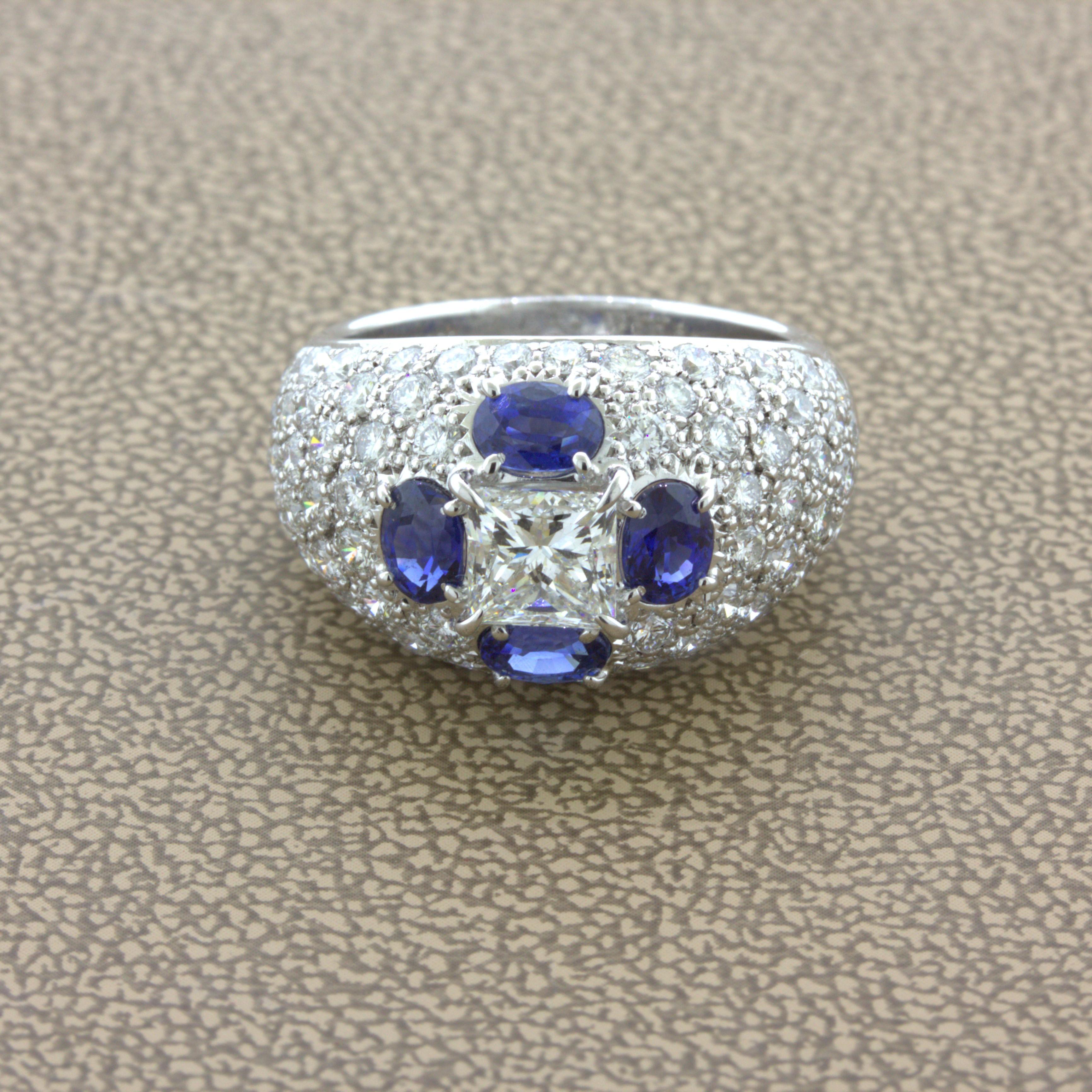 A chic and elegant platinum ring featuring a 1.02 carat princess-cut diamond! It has a G-H color and is eye-clean with no visible inclusions, a very fine quality stone. It is complemented by 4 oval-shaped blue sapphires, weighing 1.66 carats,
